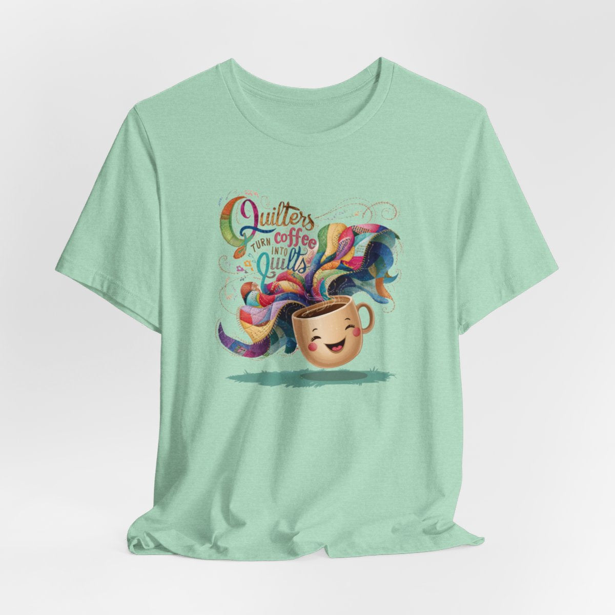 A Heather Mint funny quilting T-Shirt with the phrase Quilters Turn Coffee Into Quilts showing a fun coffee cup and quilting design