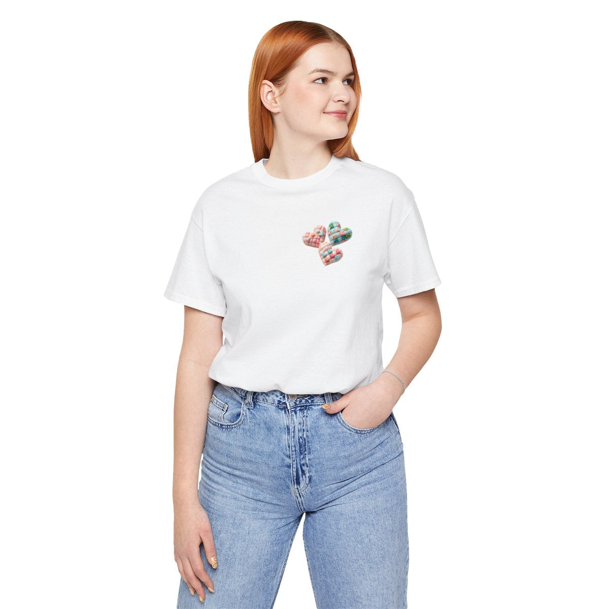 A White Tshirt featuring Three heart-shaped quilted designs arranged together. Each heart features different quilting patterns and textures, including patchwork, floral prints, and tiny embroidered hearts. The hearts are in pastel shades of pink and blue, with white accents.