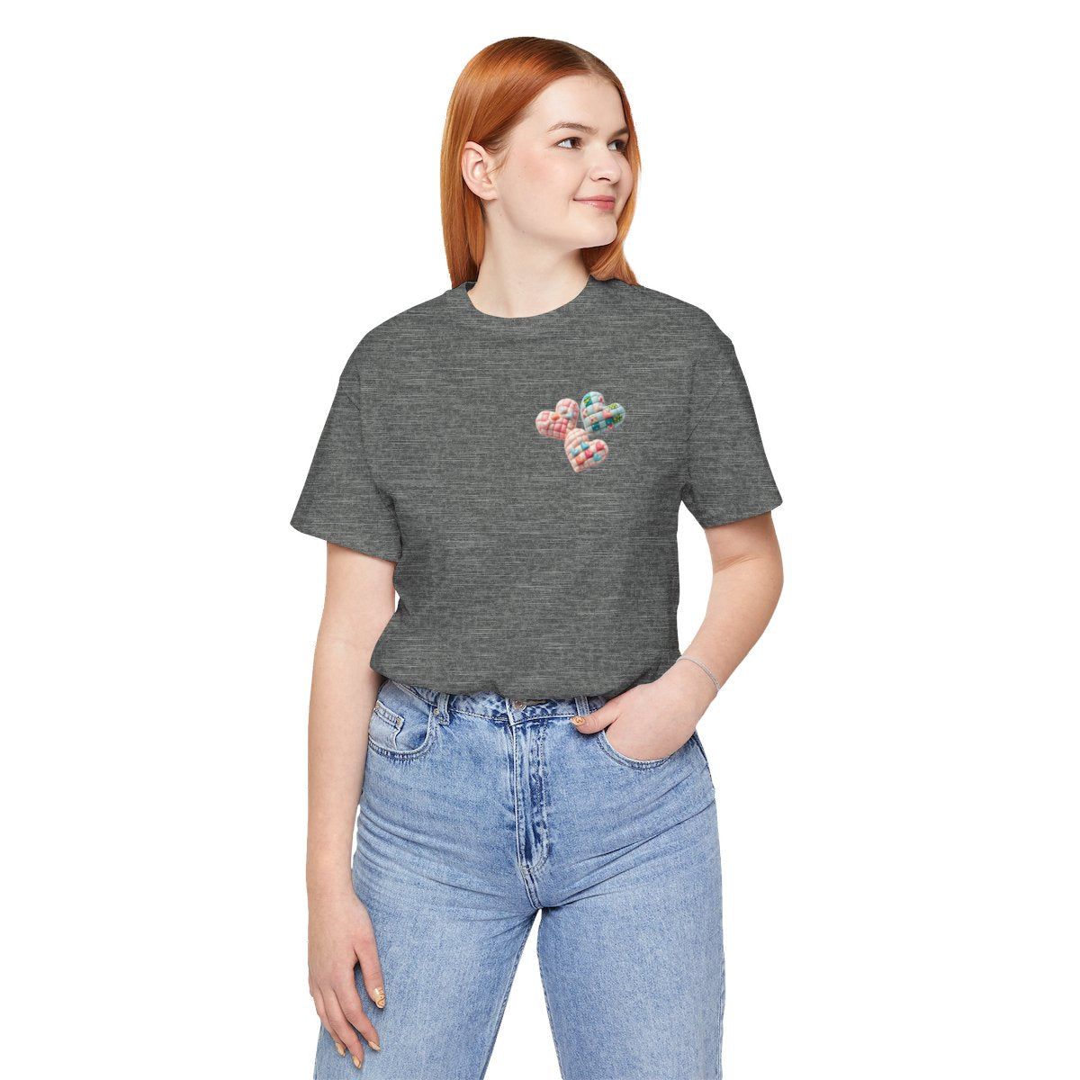 A Deep Heather Tshirt featuring Three heart-shaped quilted designs arranged together. Each heart features different quilting patterns and textures, including patchwork, floral prints, and tiny embroidered hearts. The hearts are in pastel shades of pink and blue, with white accents.