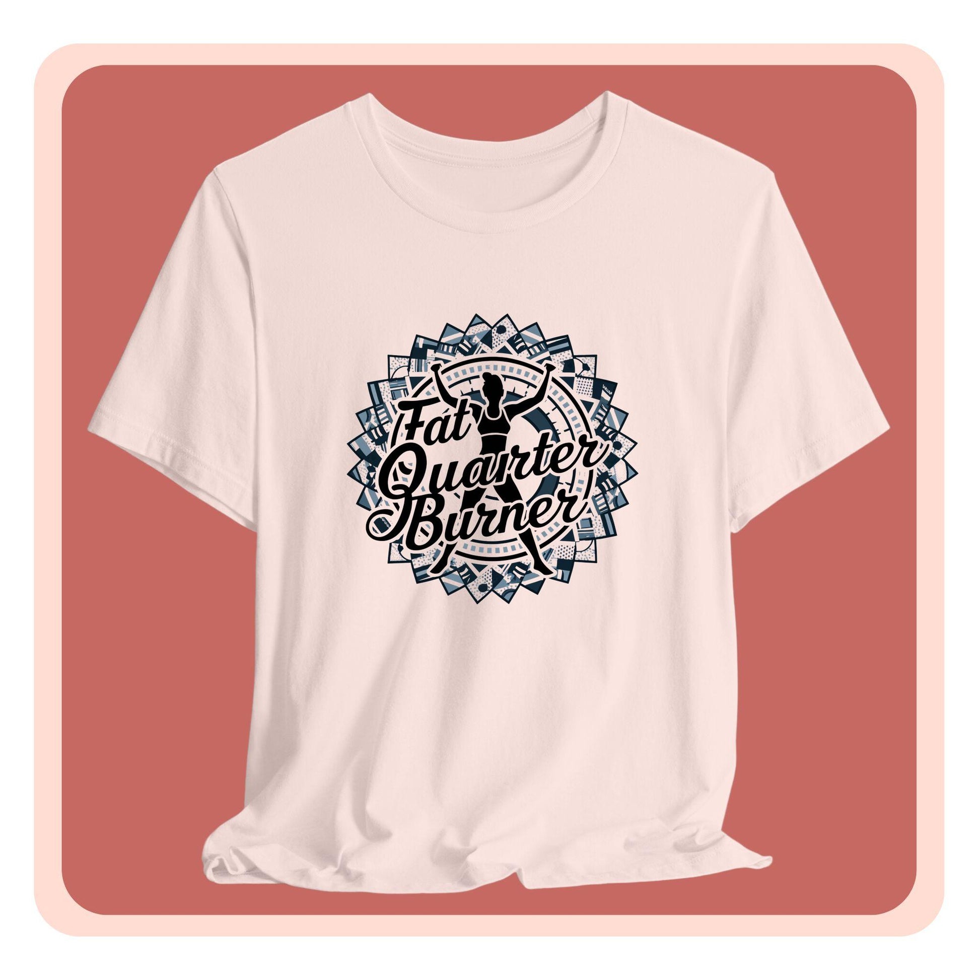 A T-Shirt featuring a patchwork border surrounding silhouette of woman lifting weights. Text reads "Fat Quarter Burner" in bold script.