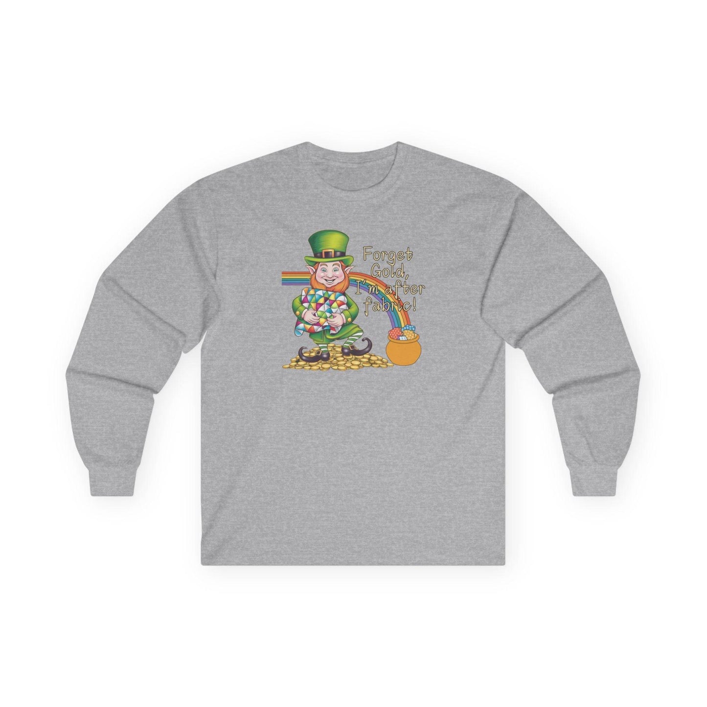 A Sport Grey long-sleeve t-shirt featuring a cheerful leprechaun holding a quilt, sitting on gold coins, with a rainbow leading to a fabric-filled pot and the phrase 'Forget Gold, I’m After Fabric!' Perfect for quilters celebrating St. Patrick’s Day.