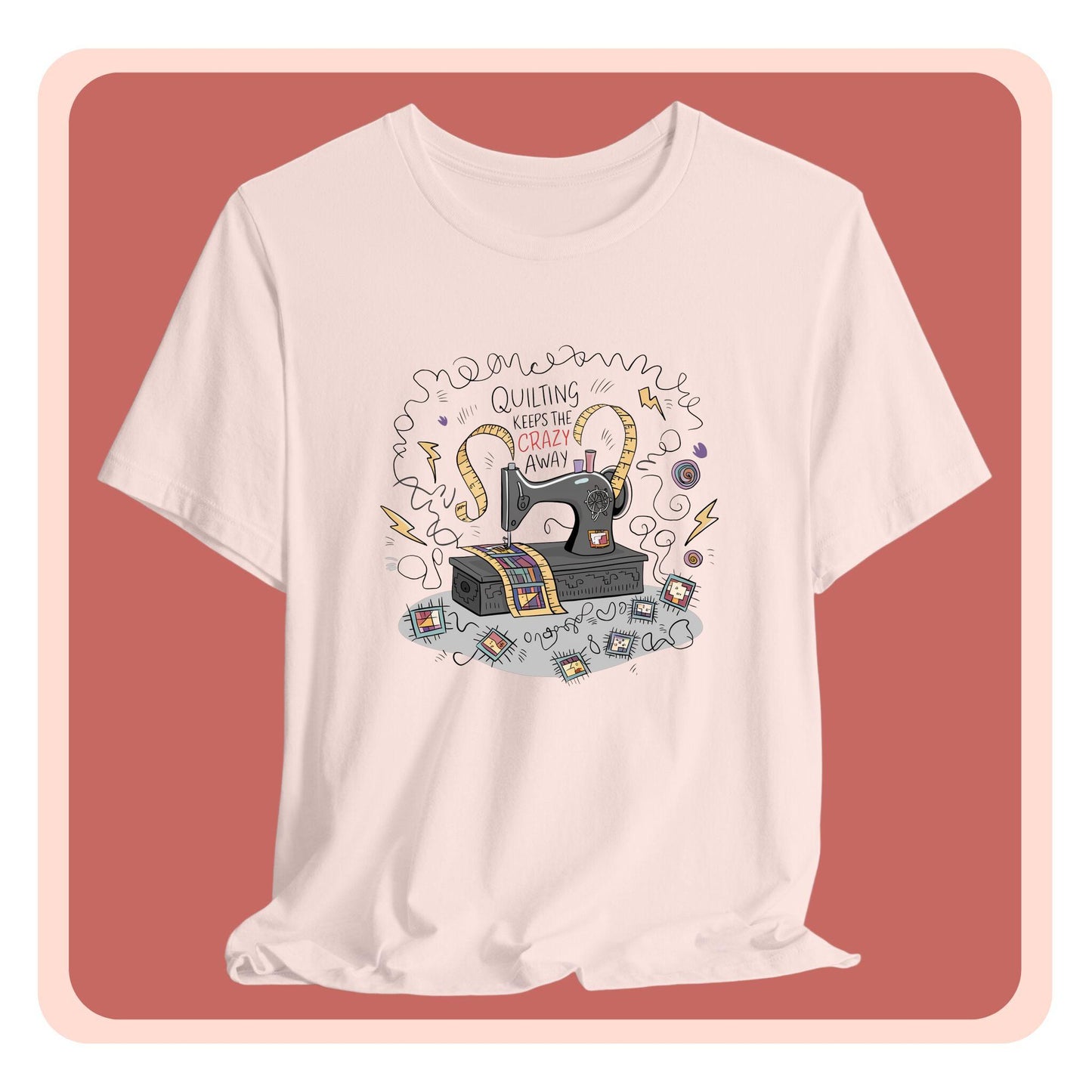 A T-Shirt with a vintage sewing machine, measuring tape heart, and text "Quilting Keeps the Crazy Away" amidst swirls and quilting motifs.