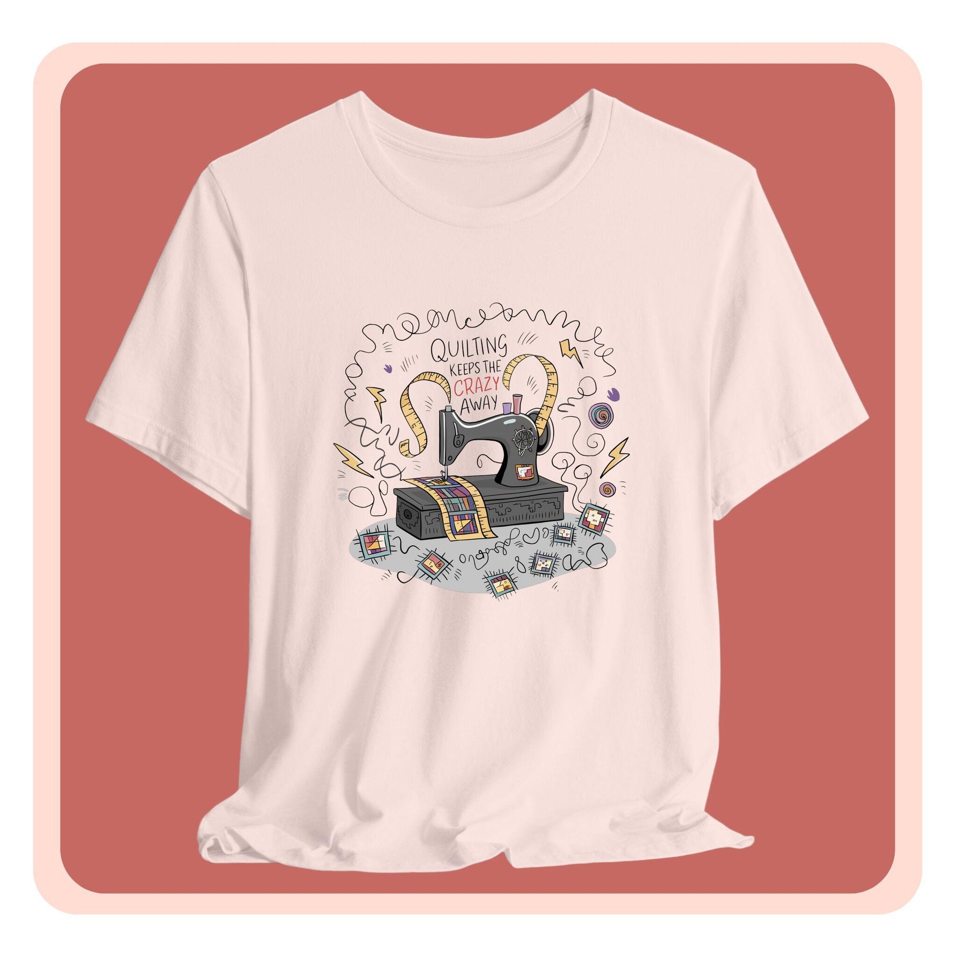 A T-Shirt with a vintage sewing machine, measuring tape heart, and text "Quilting Keeps the Crazy Away" amidst swirls and quilting motifs.