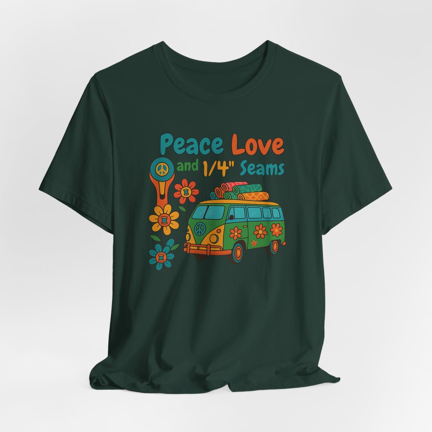 A A Forest t-shirt with colorful retro design showing a peace sign rotary cutter, patchwork van, and text “Peace Love and 1/4" Seams.” Surrounded by flowers made of thread spools. Fun vintage-style quilting shirt.