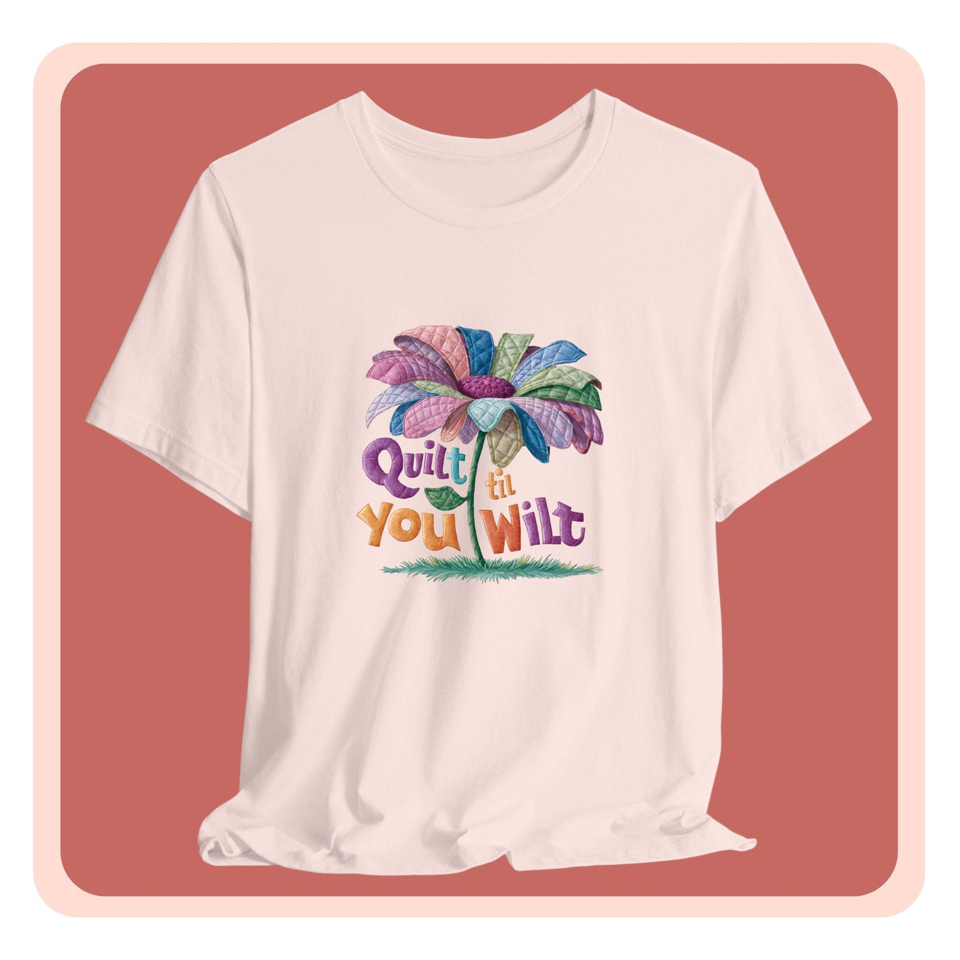 A funny quilting T-Shirt with the phrase Quilt 'Till You Wilt showing a cheerful, but slightly wilted quilted flower design