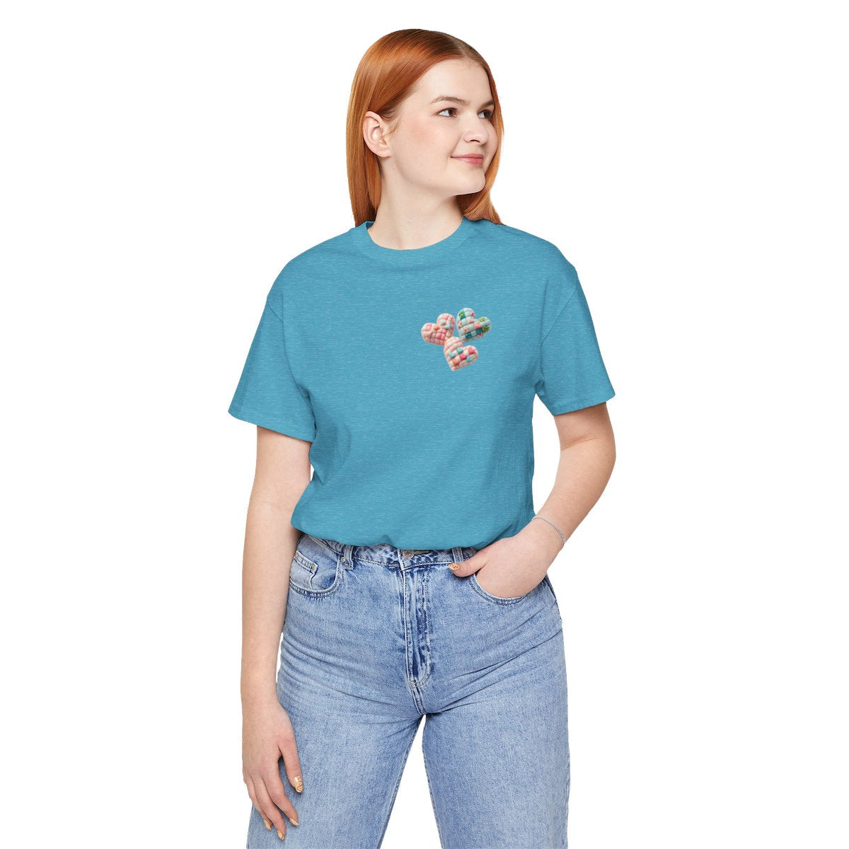 A Heather Aqua Tshirt featuring Three heart-shaped quilted designs arranged together. Each heart features different quilting patterns and textures, including patchwork, floral prints, and tiny embroidered hearts. The hearts are in pastel shades of pink and blue, with white accents.