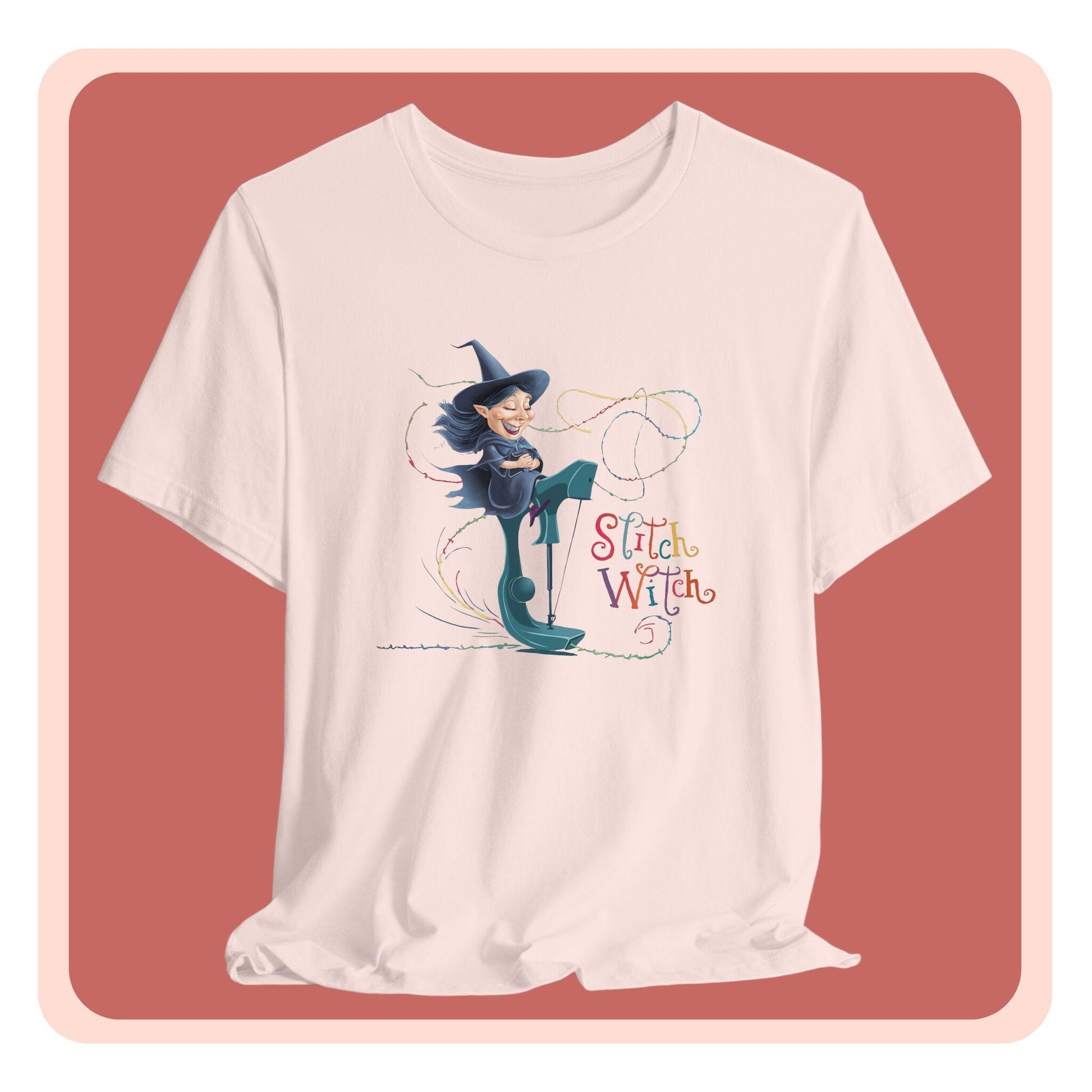 A T-shirt with a cartoon illustration of a smiling witch with pointed hat riding a teal sewing machine. Colorful stitches swirl around her in the air. Text reads "Stitch Witch" in playful, multicolored letters.