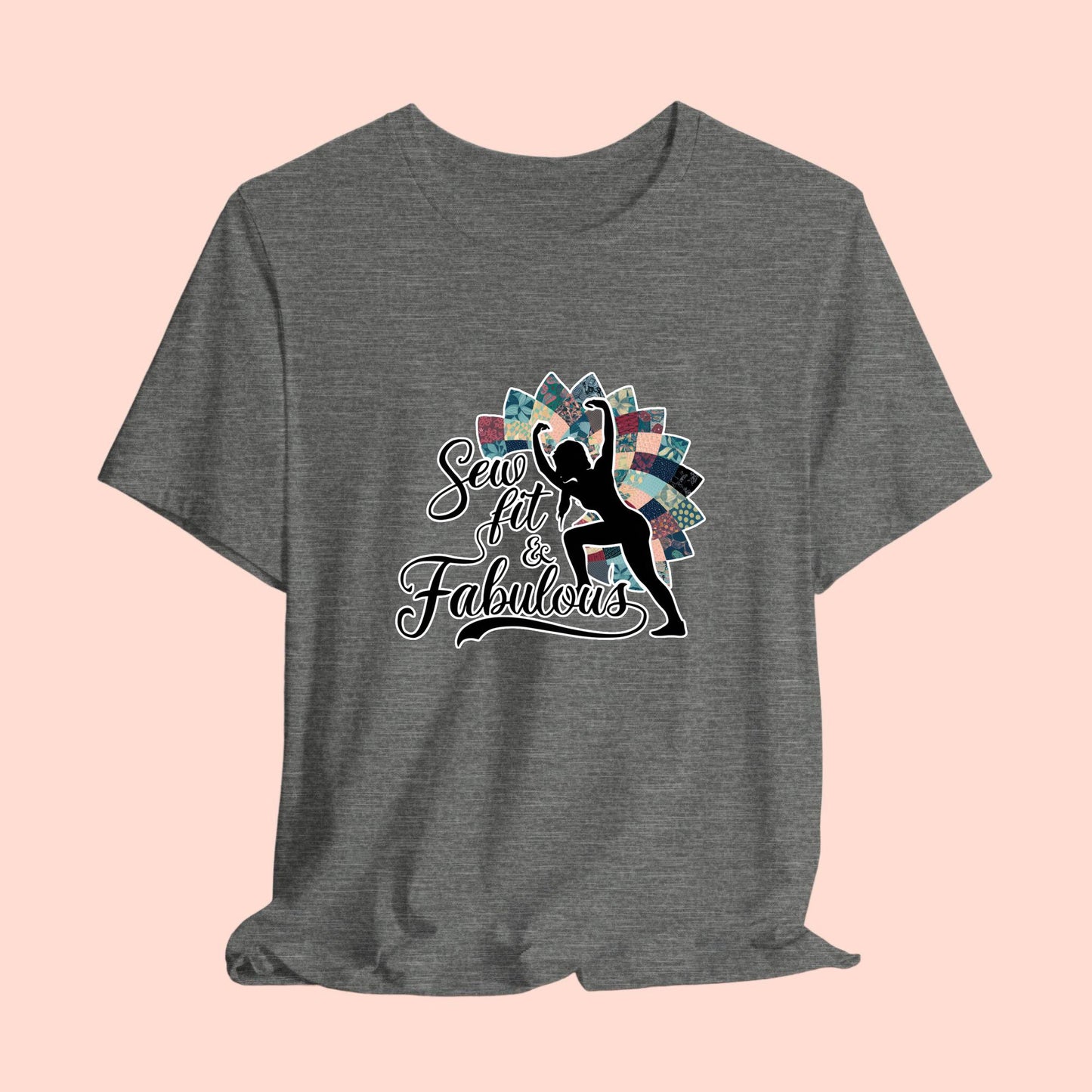 A T-Shirt featuring a black silhouette of woman with raised arms against colorful patchwork background. Text reads "Sew fit & Fabulous" in stylized script.