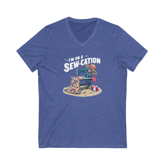 Heather Blue t-shirt with a graphic design and text 'I'm on a Sew-cation' on a white background