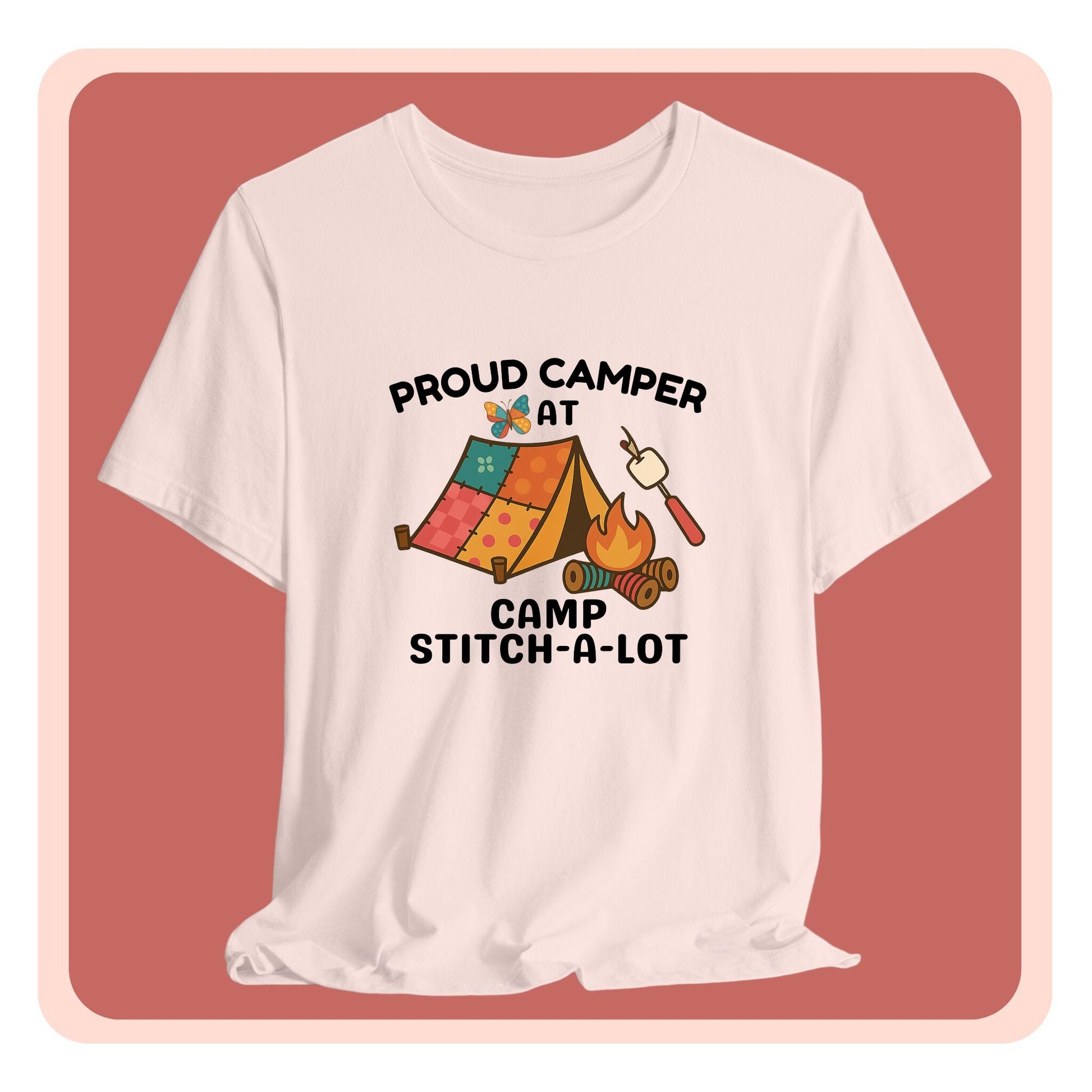 A A t-shirt featuring a colorful design with a patchwork tent, thread spool campfire, marshmallow on a seam ripper stick, and a butterfly. Text reads "Proud Camper at Camp Stitch-a-Lot." Fun gift for quilting retreats.