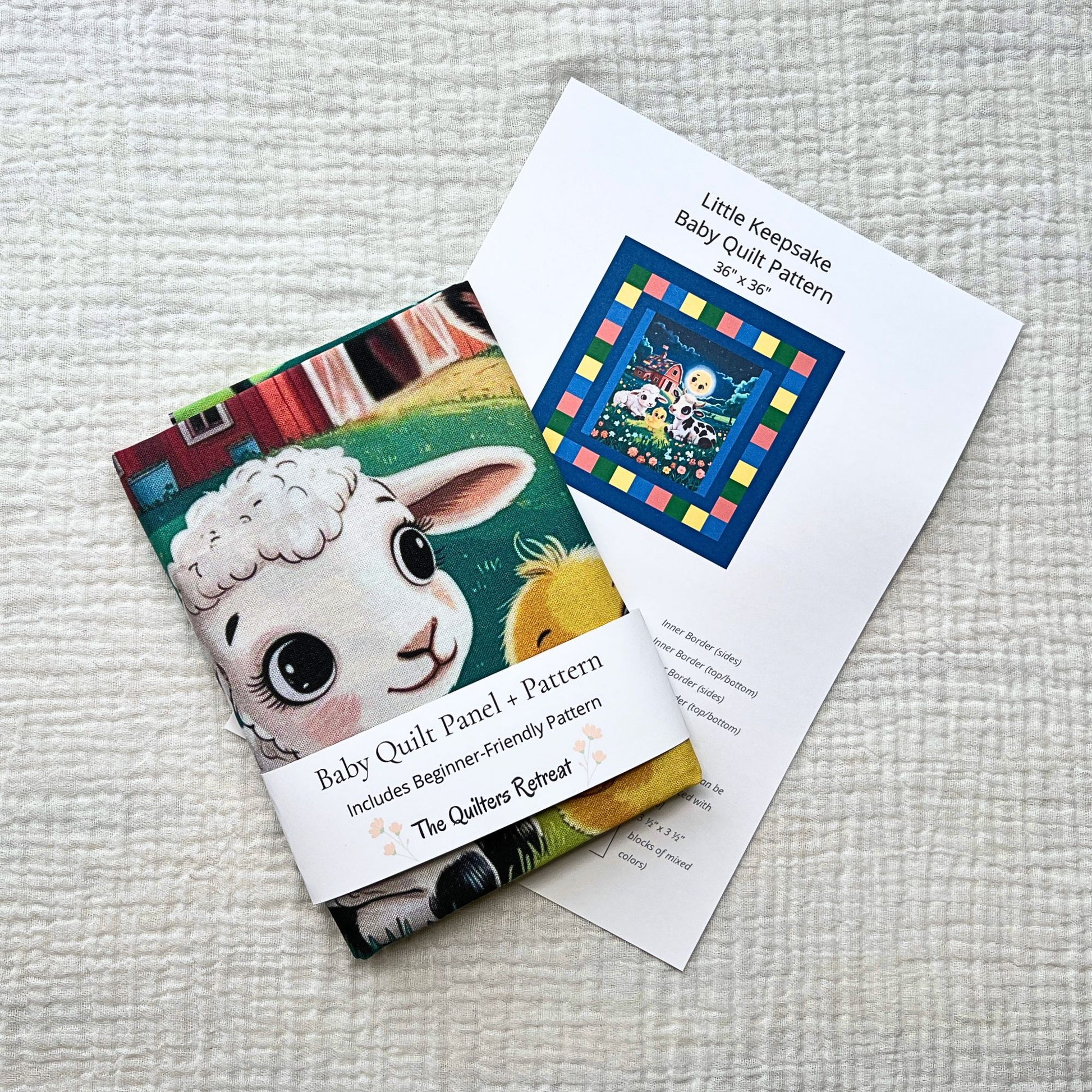 Farm friends baby quilt panel with beginner-friendly pattern, folded with pattern card