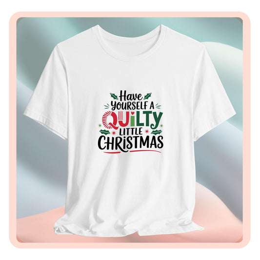 A fun holiday-themed t-shirt featuring the phrase "Have Yourself a Quilty Little Christmas" with quilting-inspired elements and holiday decorations such as holly and stars.
