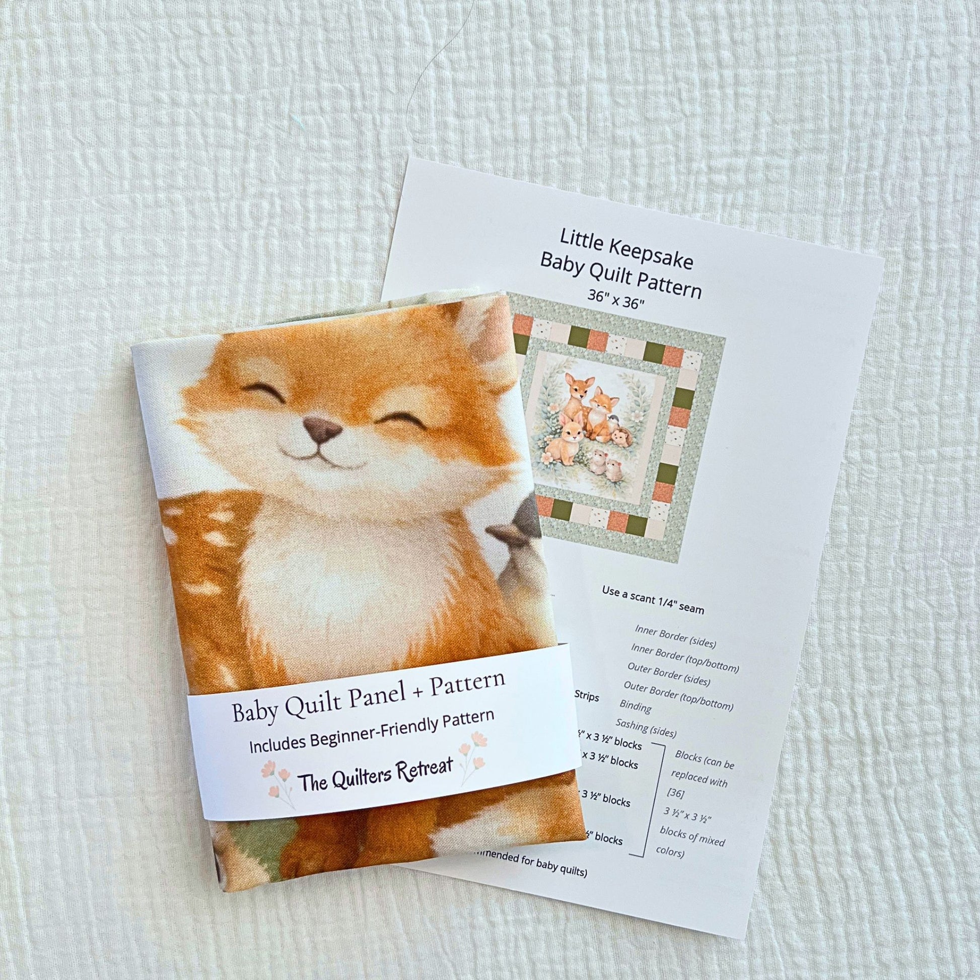 Woodland friends baby quilt panel with beginner-friendly pattern, folded with pattern card