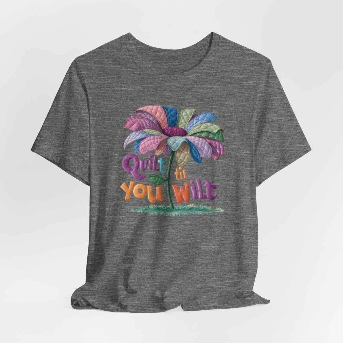 A Deep Heather funny quilting T-Shirt with the phrase Quilt 'Till You Wilt showing a cheerful, but slightly wilted quilted flower design