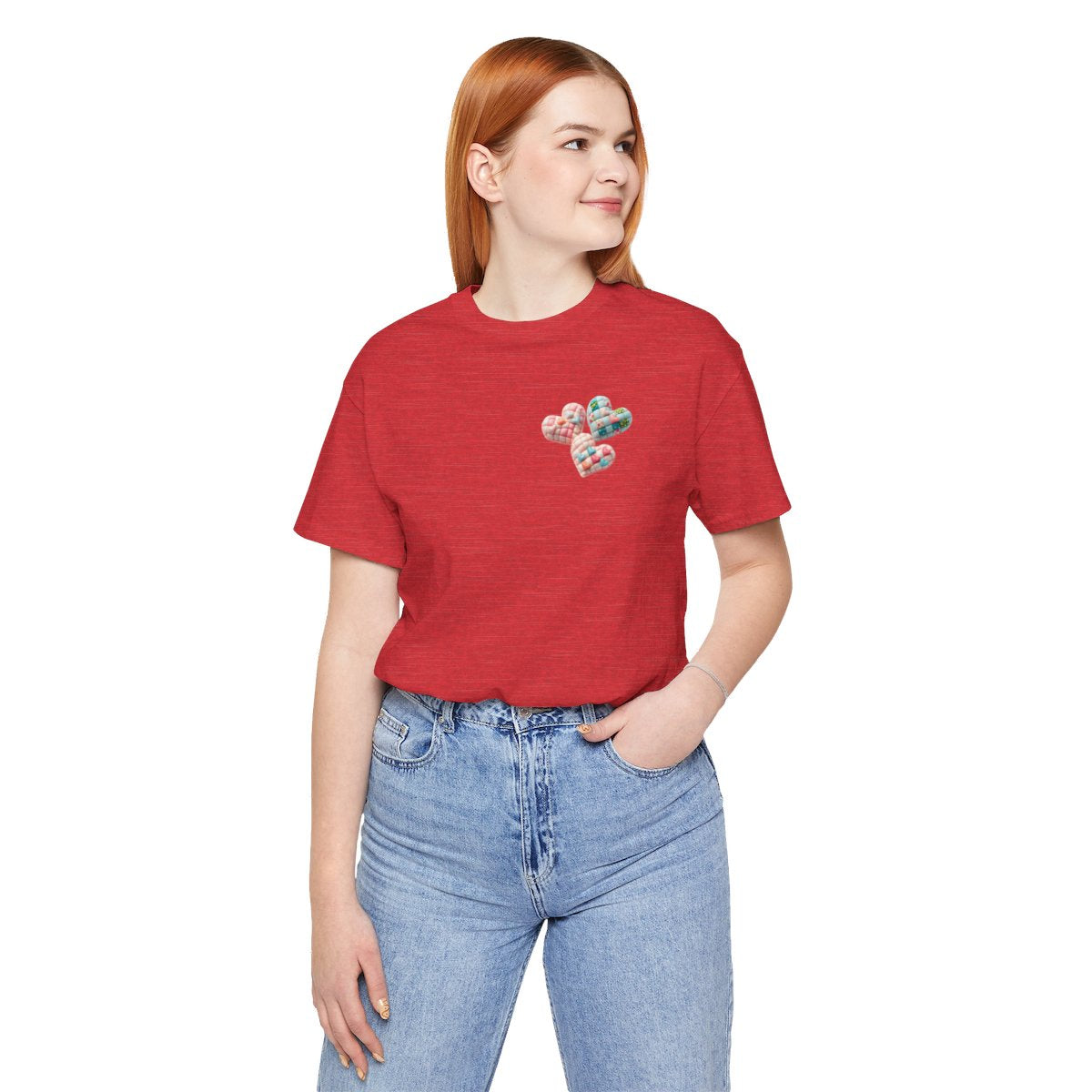 A Heather Red Tshirt featuring Three heart-shaped quilted designs arranged together. Each heart features different quilting patterns and textures, including patchwork, floral prints, and tiny embroidered hearts. The hearts are in pastel shades of pink and blue, with white accents.