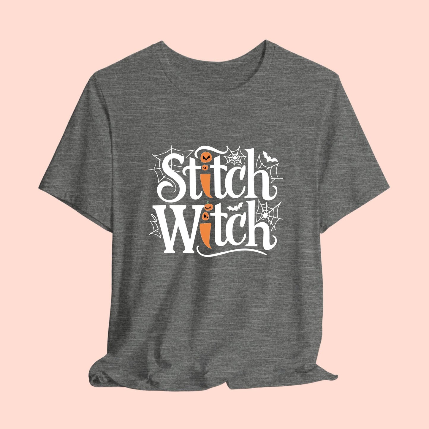 T-shirt design with "Stitch Witch" text in Halloween-themed typography. Jack-o'-lanterns, spiderwebs, and bats decorate the letters. The "i" in "Stitch" resembles a sewing needle. Ideal for quilters who love Halloween.