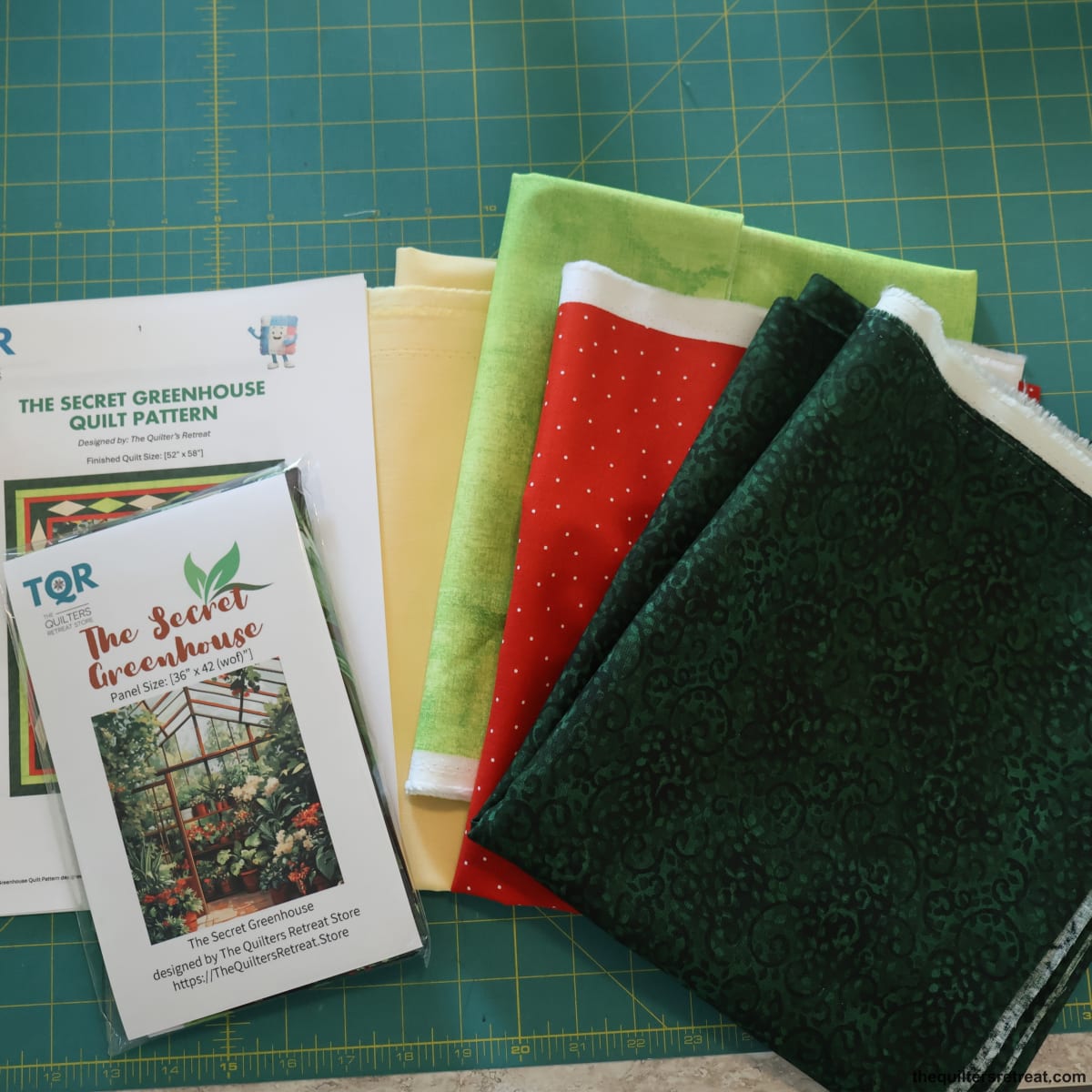 The Secret Greenhouse quilt kit — pattern plus yellow, green, red and dark-green coordinating fabrics