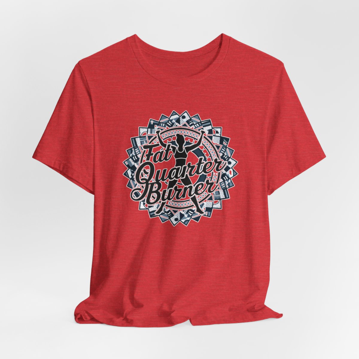 A Heather Red T-Shirt featuring a patchwork border surrounding silhouette of woman lifting weights. Text reads "Fat Quarter Burner" in bold script.