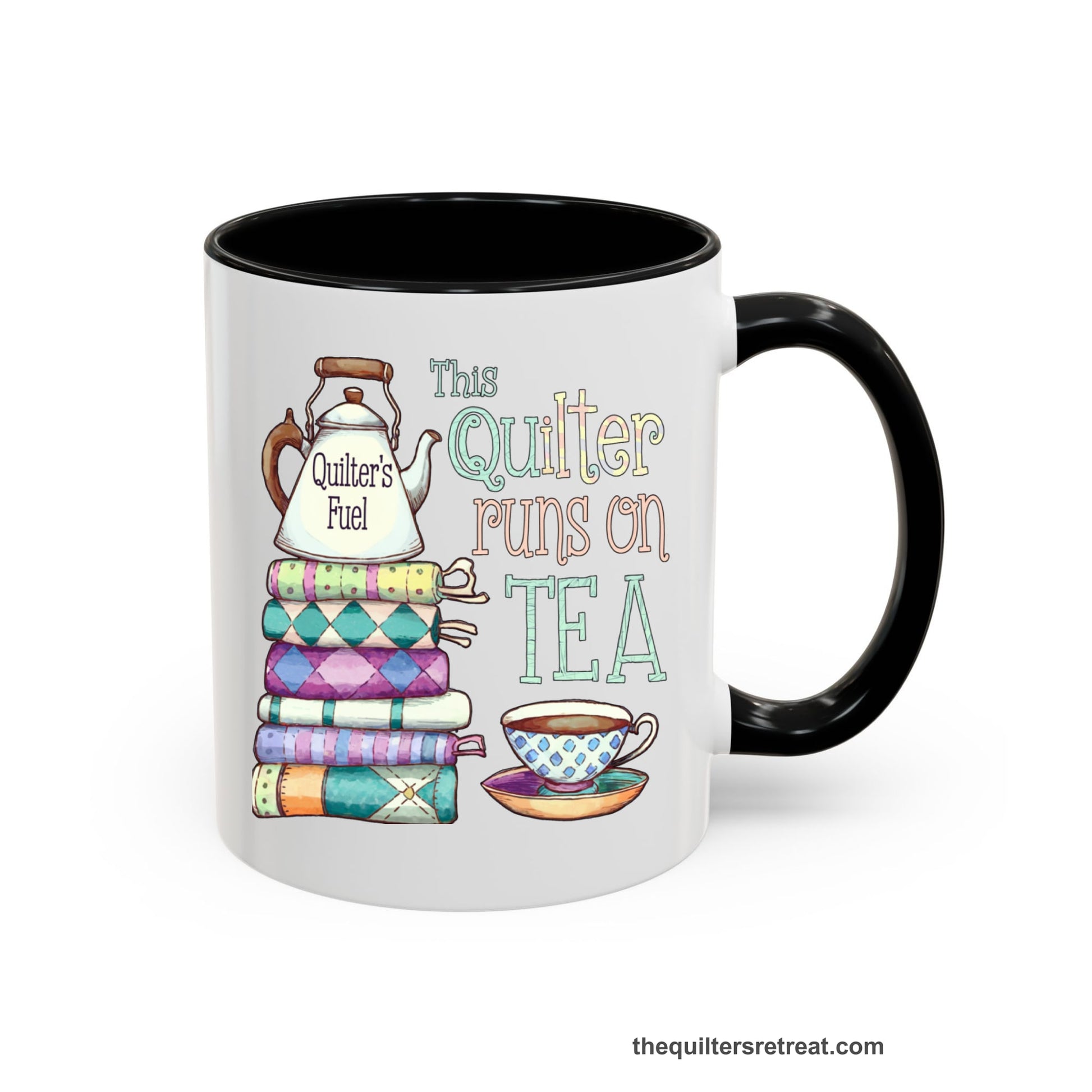 A Black Self-Fulfilled Ceramic Accent Mug with a stack of colorful quilts with teapot and cup, whimsical "This Quilter Runs on Tea" text