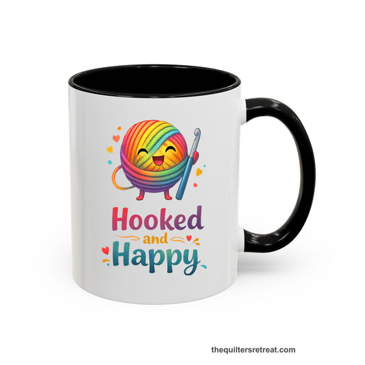 Crochet Gift: A Black Ceramic Accent Mug with Smiling rainbow yarn ball with crochet hook, hearts, and "Hooked and Happy" text, whimsical style.