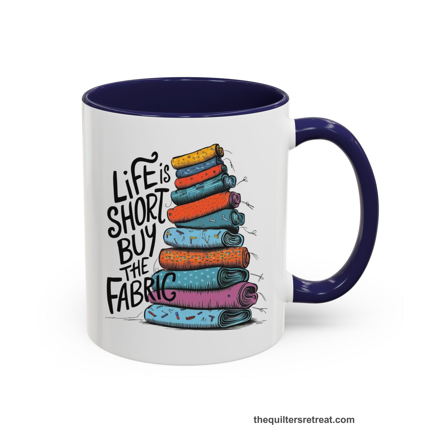 A Navy Self-Fulfilled Accent Mug with a illustration of colorful fabric rolls with bold "Life is Short Buy the Fabric" text