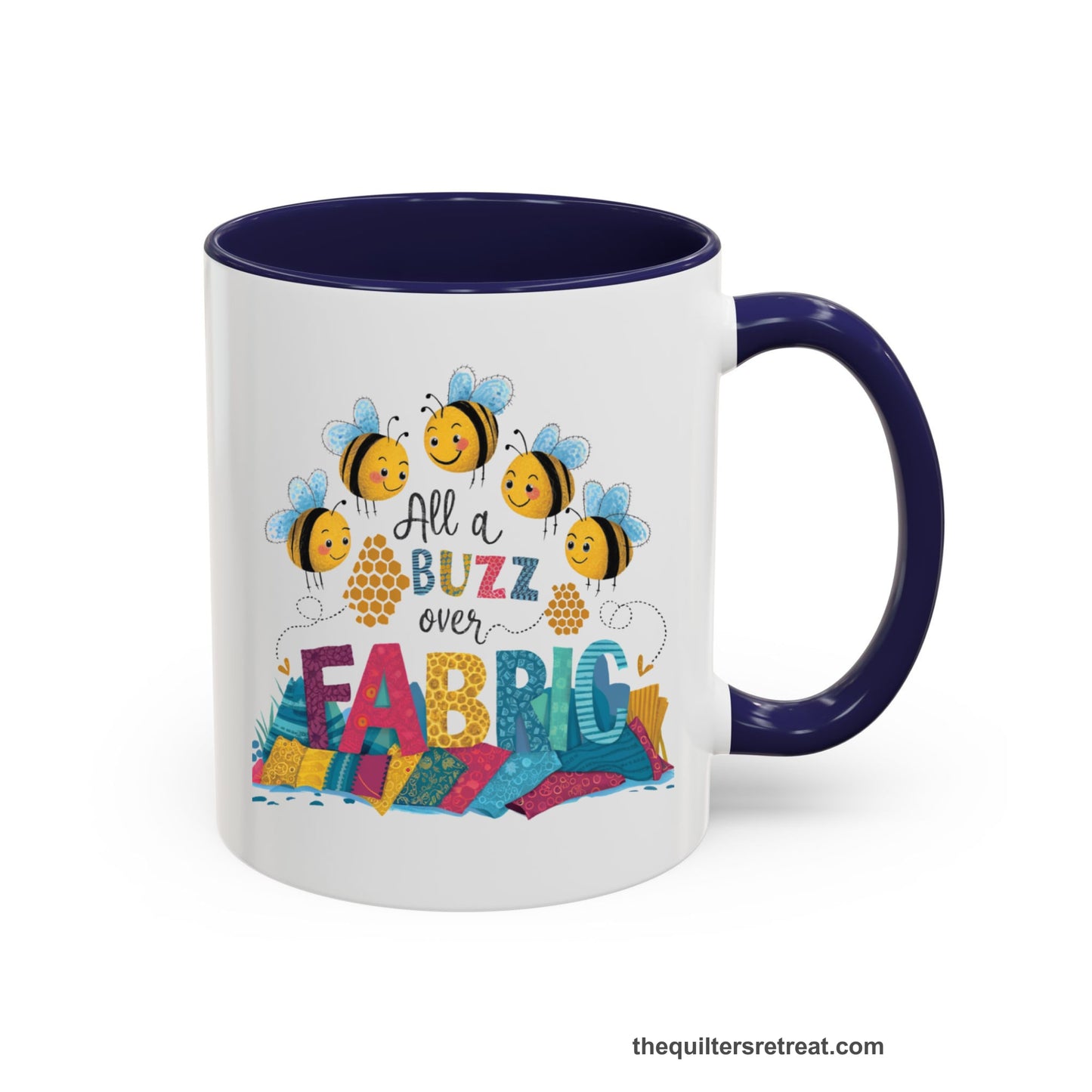 A Navy Self-Fulfilled Accent Mug with a playful bees with "All a Buzz over Fabric" text and colorful fabric stacks