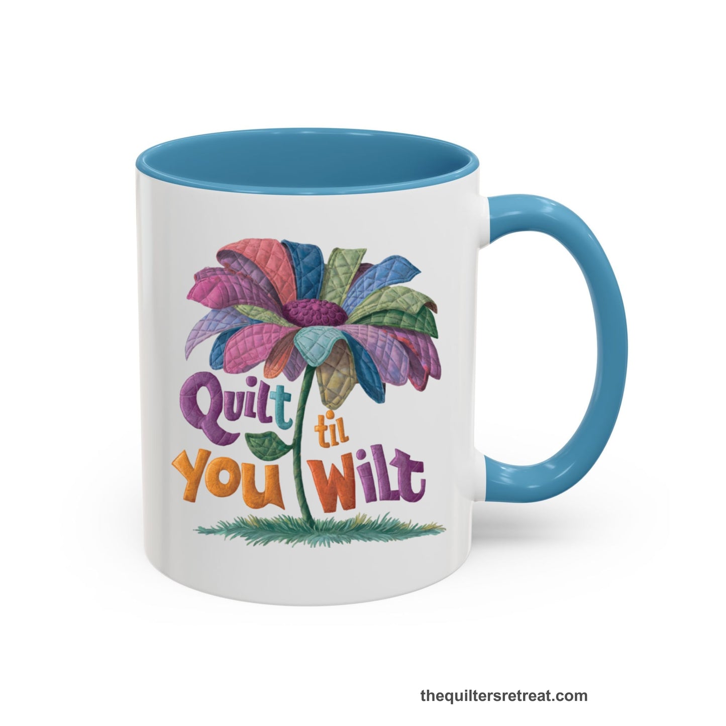A Light Blue Self-Fulfilled Accent Mug with a whimsical quilted flower with bold "Quilt til You Wilt" text