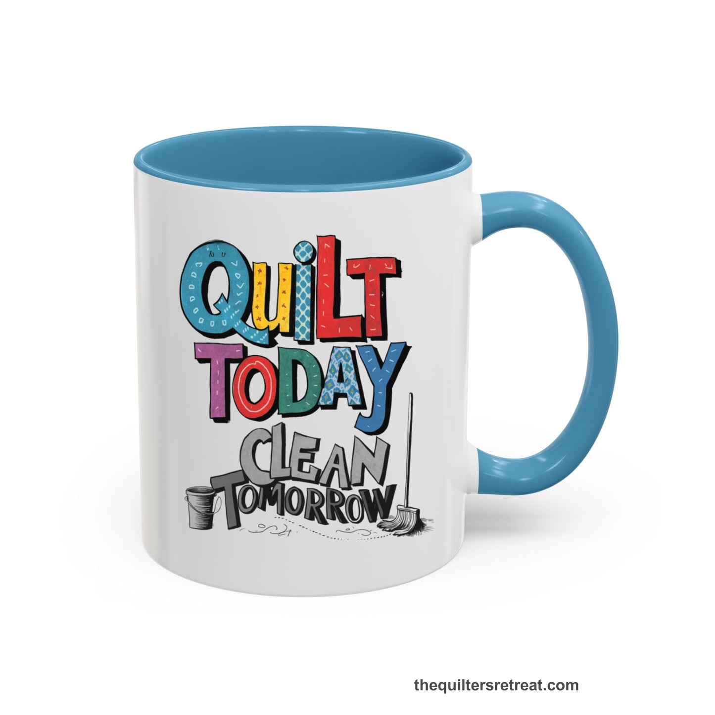 A Light Blue Self-Fulfilled Accent Mug with a playful "Quilt Today Clean Tomorrow" text with colorful patterns and cleaning tools illustration