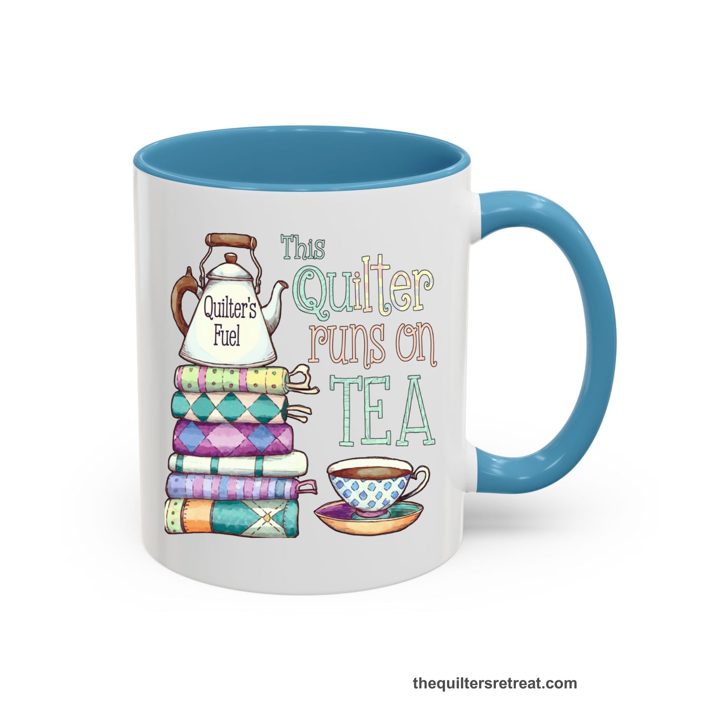 A Light Blue Self-Fulfilled Ceramic Accent Mug with a stack of colorful quilts with teapot and cup, whimsical "This Quilter Runs on Tea" text