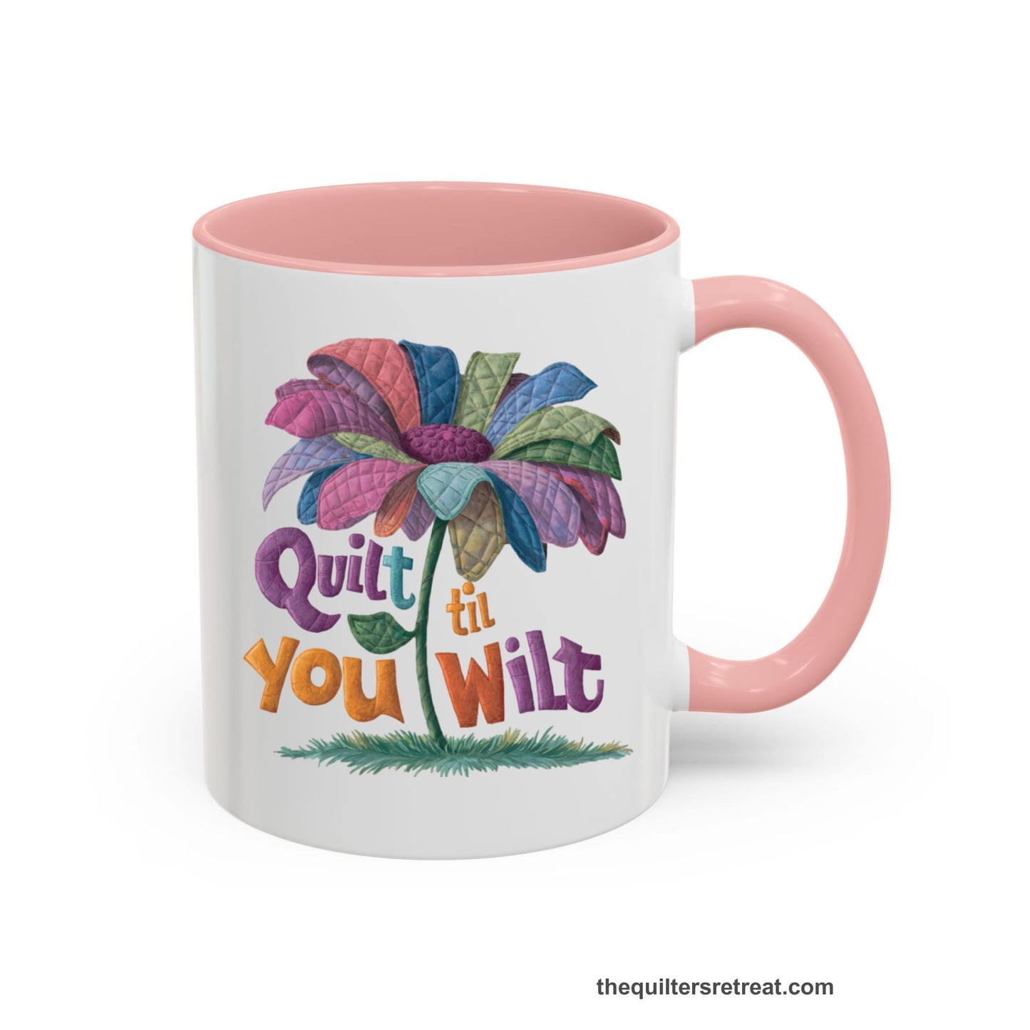 A Pink Self-Fulfilled Accent Mug with a whimsical quilted flower with bold "Quilt til You Wilt" text