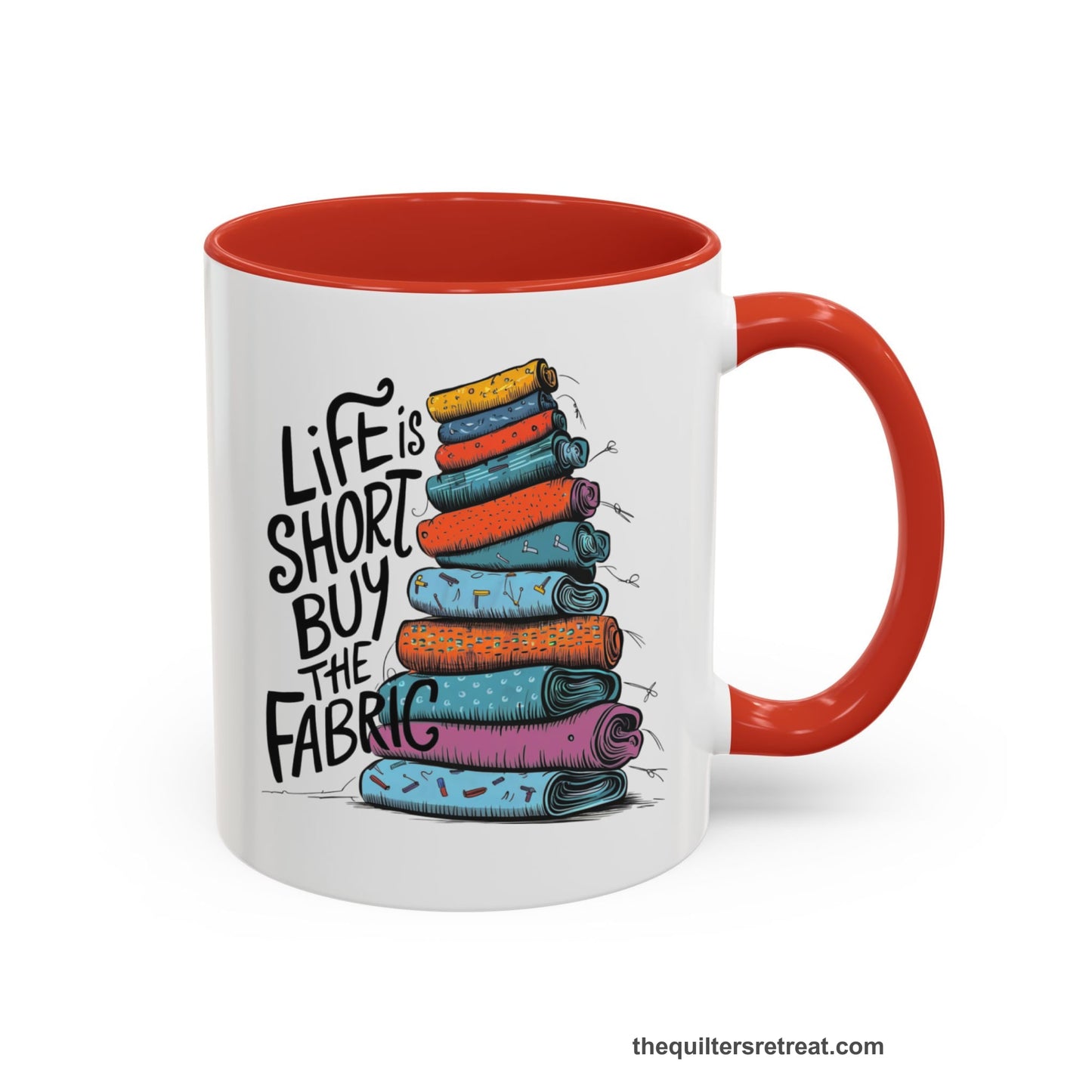 A Red Self-Fulfilled Accent Mug with a illustration of colorful fabric rolls with bold "Life is Short Buy the Fabric" text