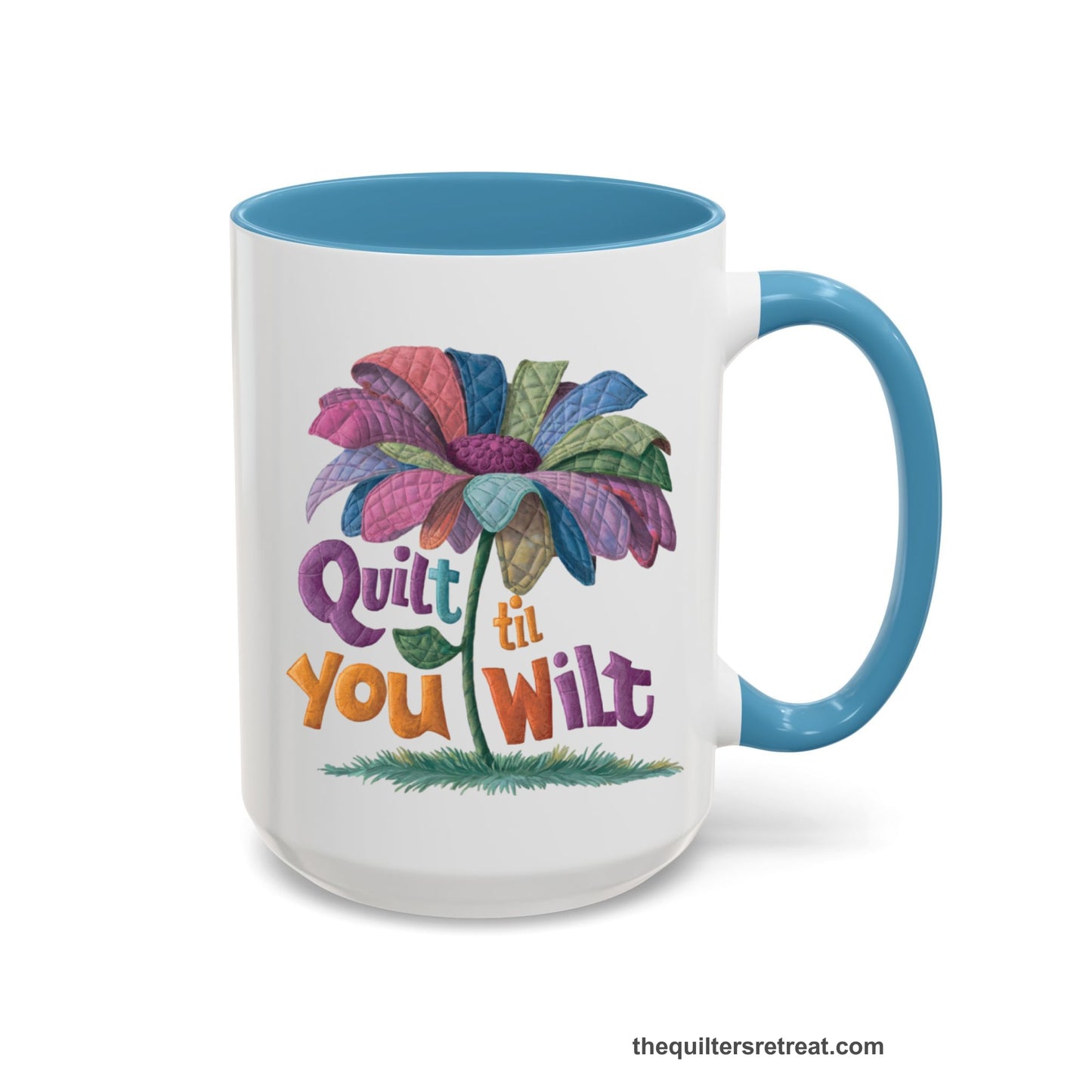 A Light Blue Self-Fulfilled Accent Mug with a whimsical quilted flower with bold "Quilt til You Wilt" text