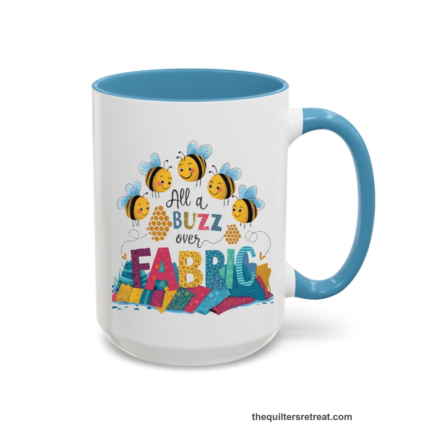 A Light Blue Self-Fulfilled Accent Mug with a playful bees with "All a Buzz over Fabric" text and colorful fabric stacks