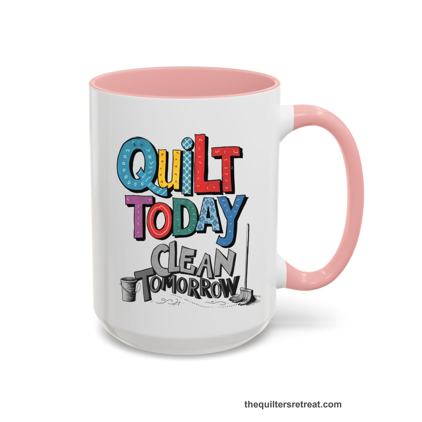 A Pink Self-Fulfilled Accent Mug with a playful "Quilt Today Clean Tomorrow" text with colorful patterns and cleaning tools illustration