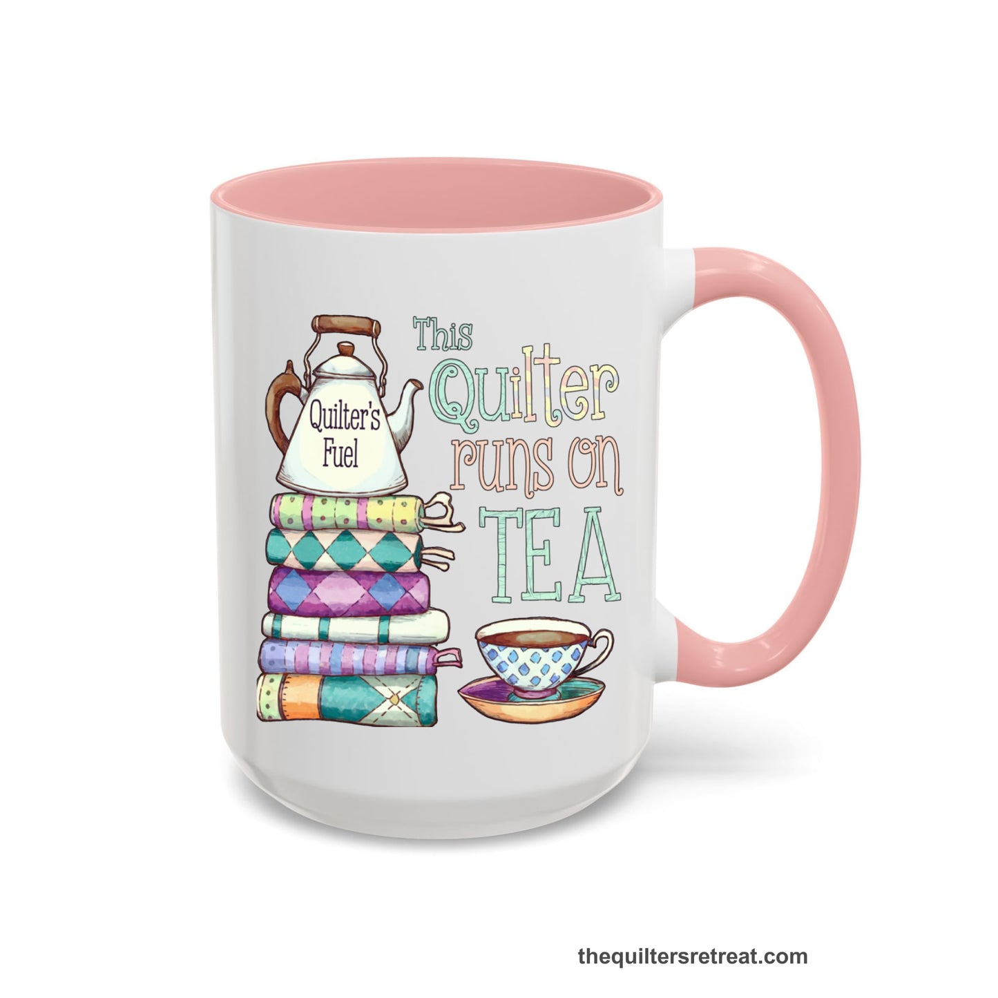 A Pink Self-Fulfilled Ceramic Accent Mug with a stack of colorful quilts with teapot and cup, whimsical "This Quilter Runs on Tea" text