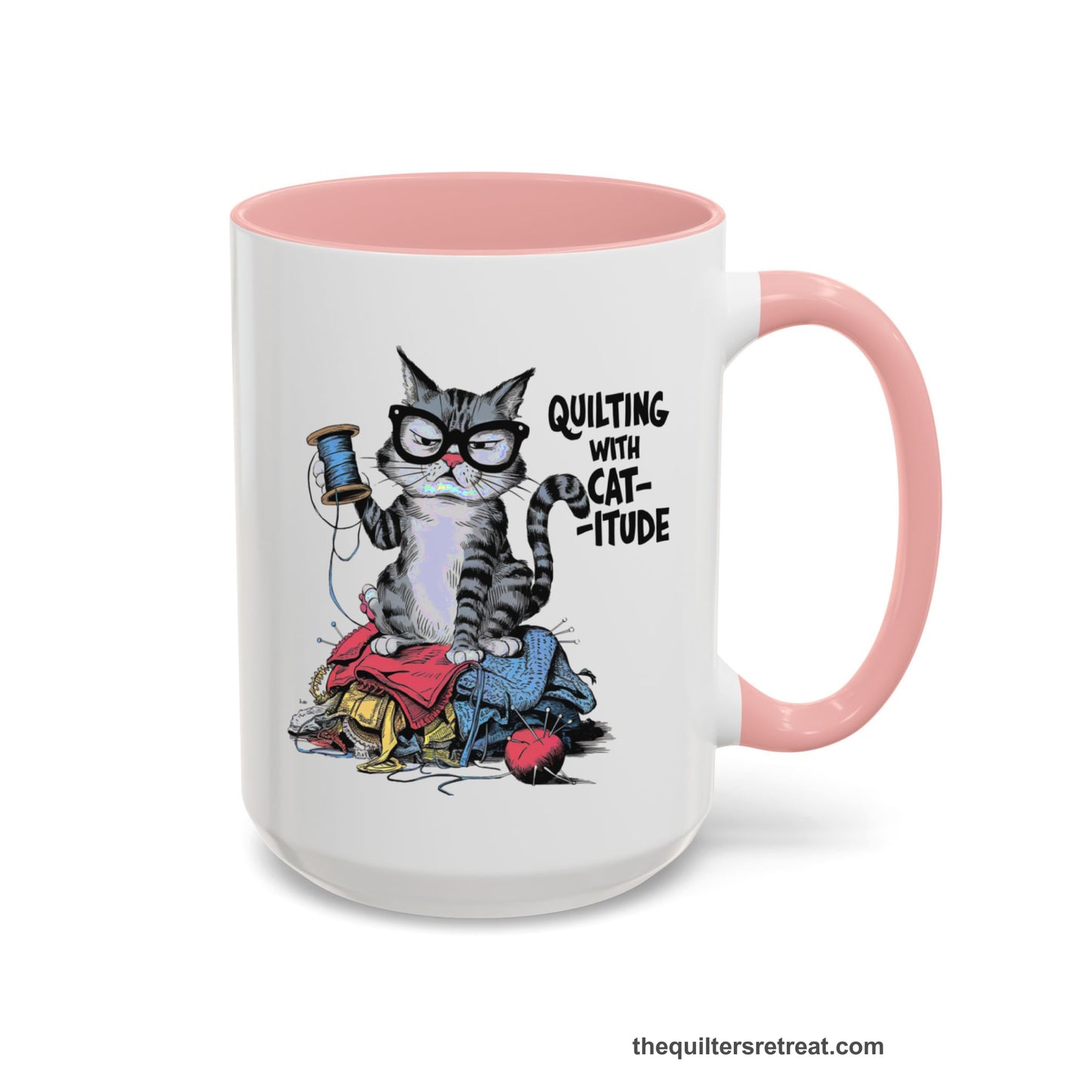 A Pink Accent Ceramic Mug featuring Quilting with Catitude design with a grumpy cat holding thread spool atop fabric pile