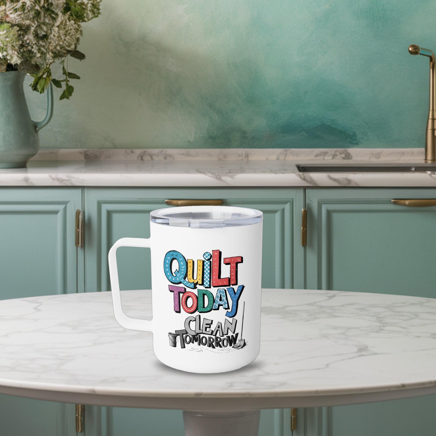 A funny quilting-inspired Insulated Mug with the phrase Quilt Today, Clean Tomorrow in a bold and cheerful font with a broom off to the side
