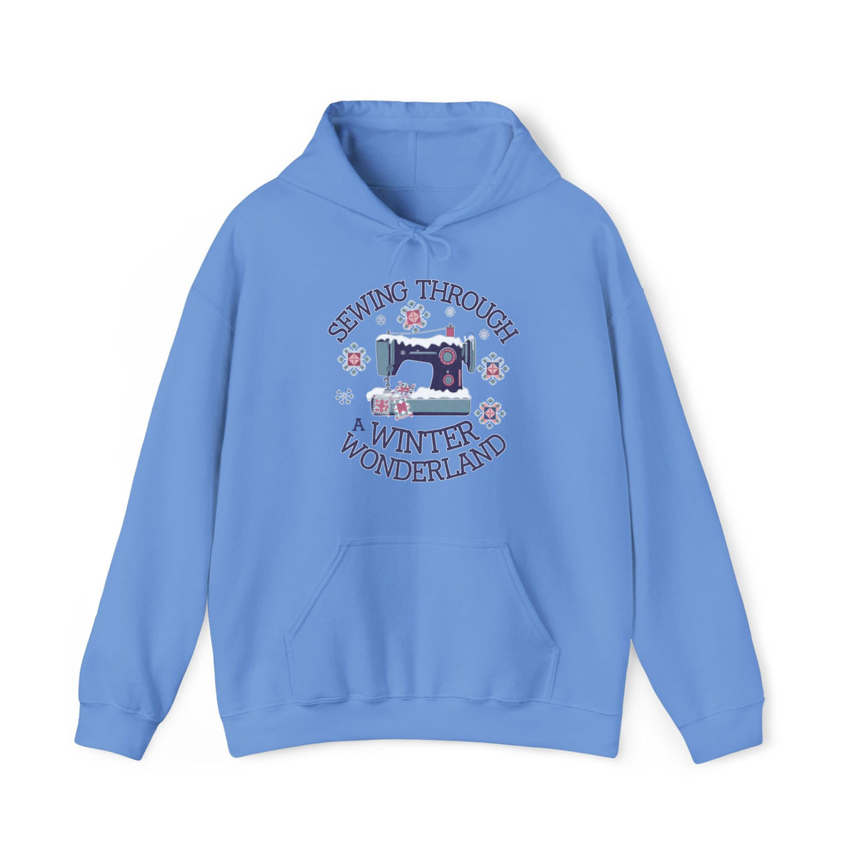 Quilter Gift: A Carolina Blue Hoodie with sewing machine covered in snow with festive quilting elements and "Sewing Through a Winter Wonderland" text