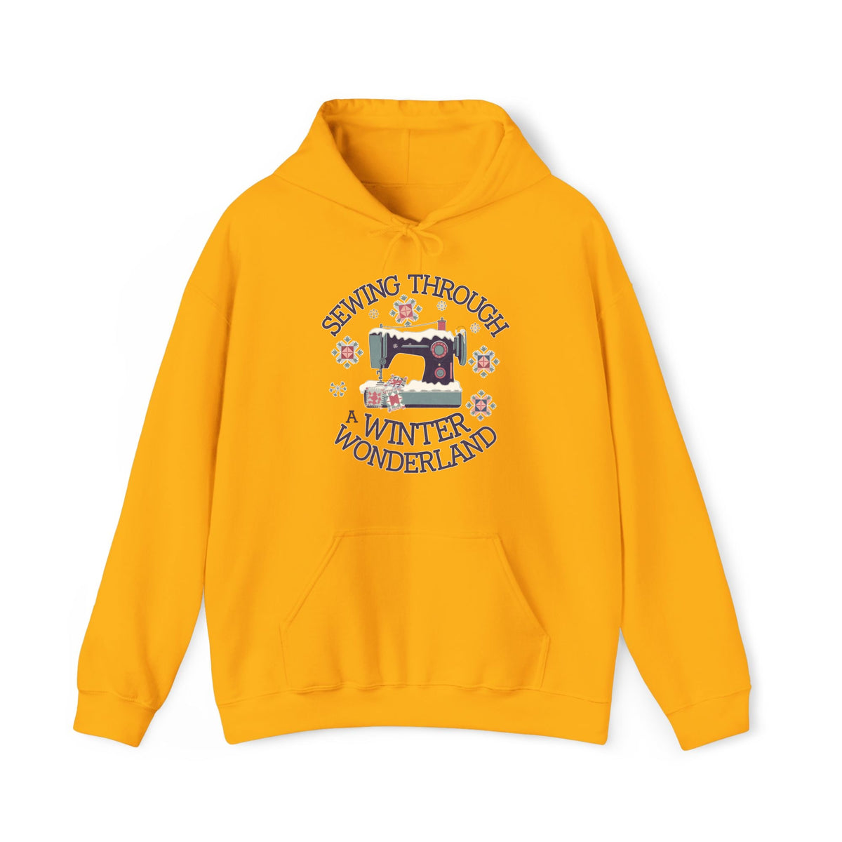 Quilter Gift: A Gold Hoodie with sewing machine covered in snow with festive quilting elements and "Sewing Through a Winter Wonderland" text