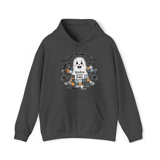 Quilter Gift: A Dark Heather Halloween Hoodie with cute patchwork ghost with "Stitching up some Scares" text and playful bats in a whimsical style