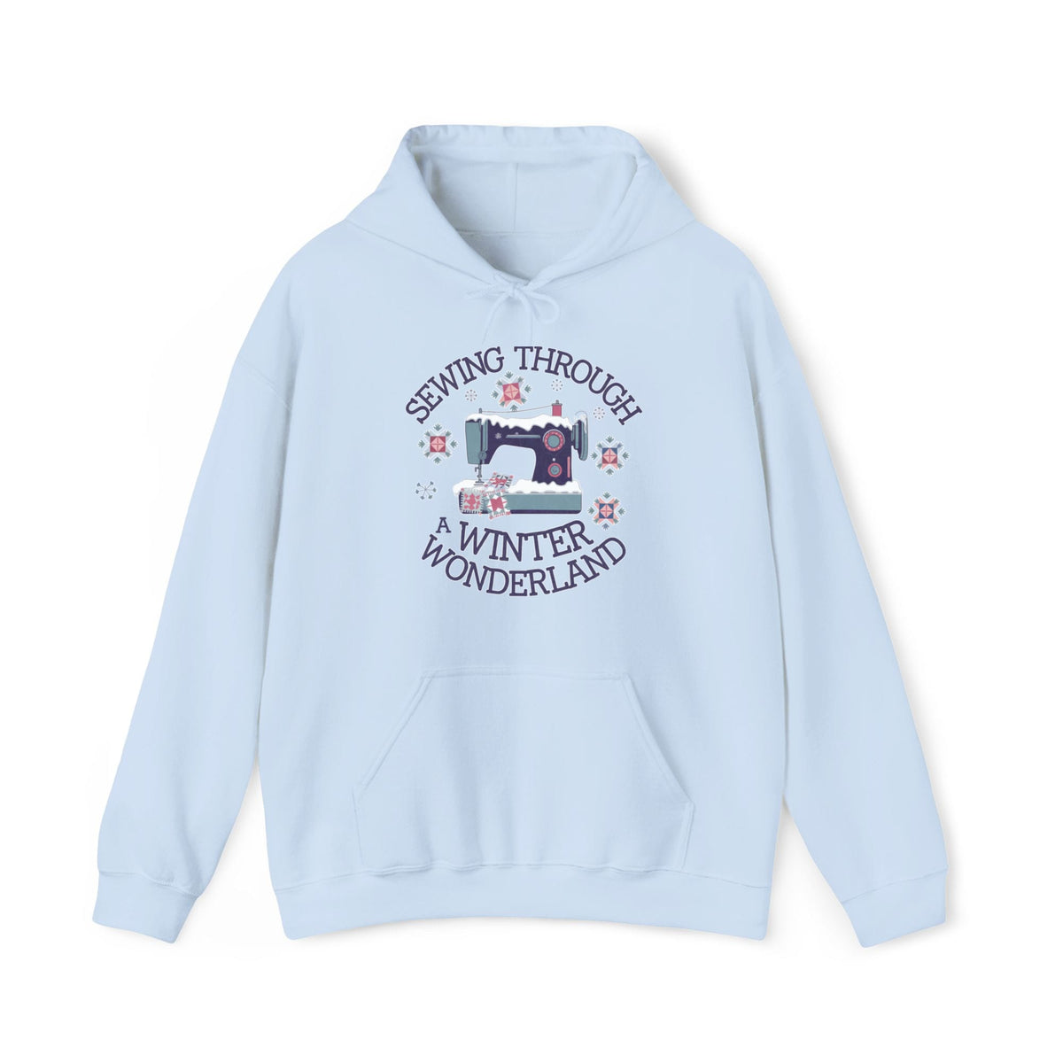 Quilter Gift: A Light Blue Hoodie with sewing machine covered in snow with festive quilting elements and "Sewing Through a Winter Wonderland" text