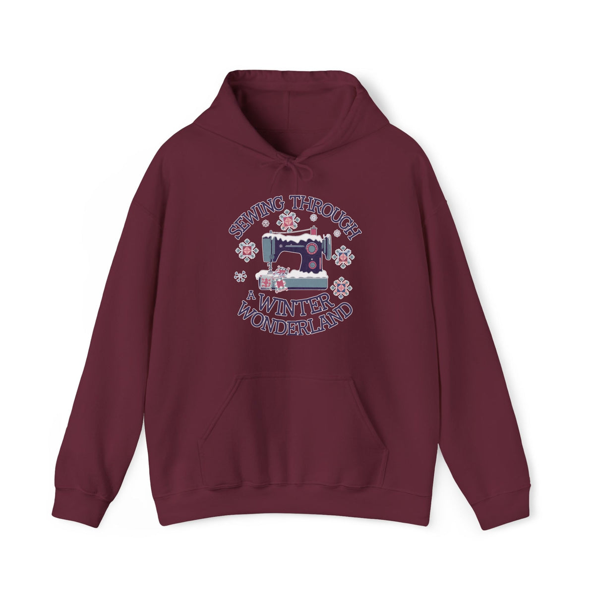 Quilter Gift: A Maroon Hoodie with sewing machine covered in snow with festive quilting elements and "Sewing Through a Winter Wonderland" text