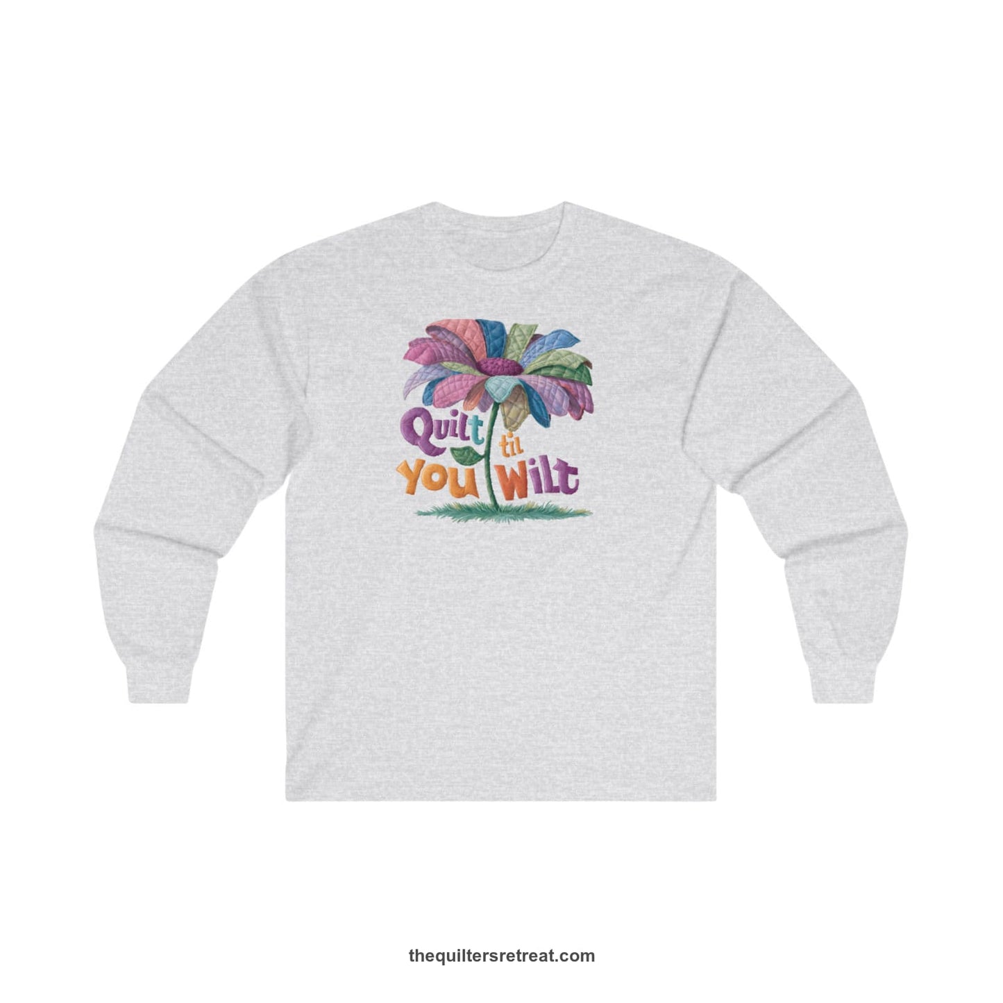 A Ash Long Sleeve T-Shirt with a whimsical quilted flower with bold "Quilt til You Wilt" text