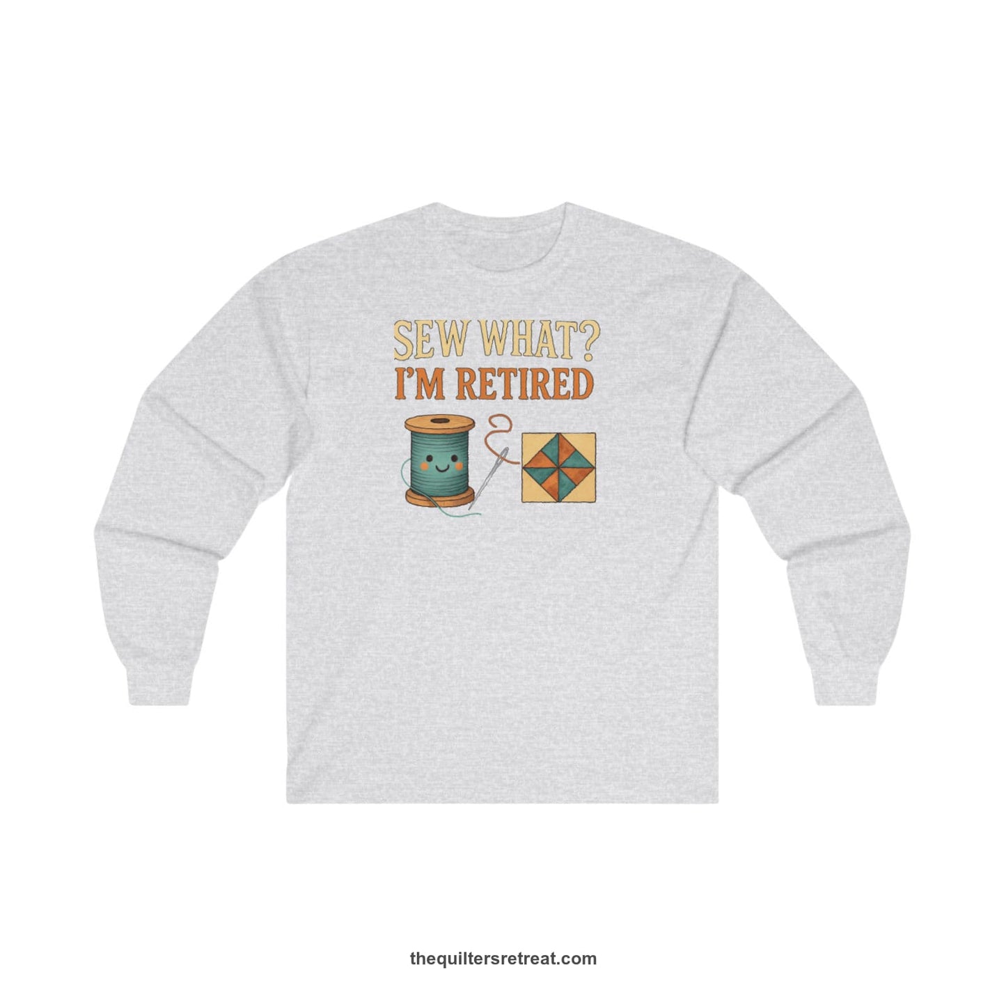 A Ash Long Sleeve T-Shirt with a funny "Sew What? I'm Retired" text with smiling spool and quilt block design
