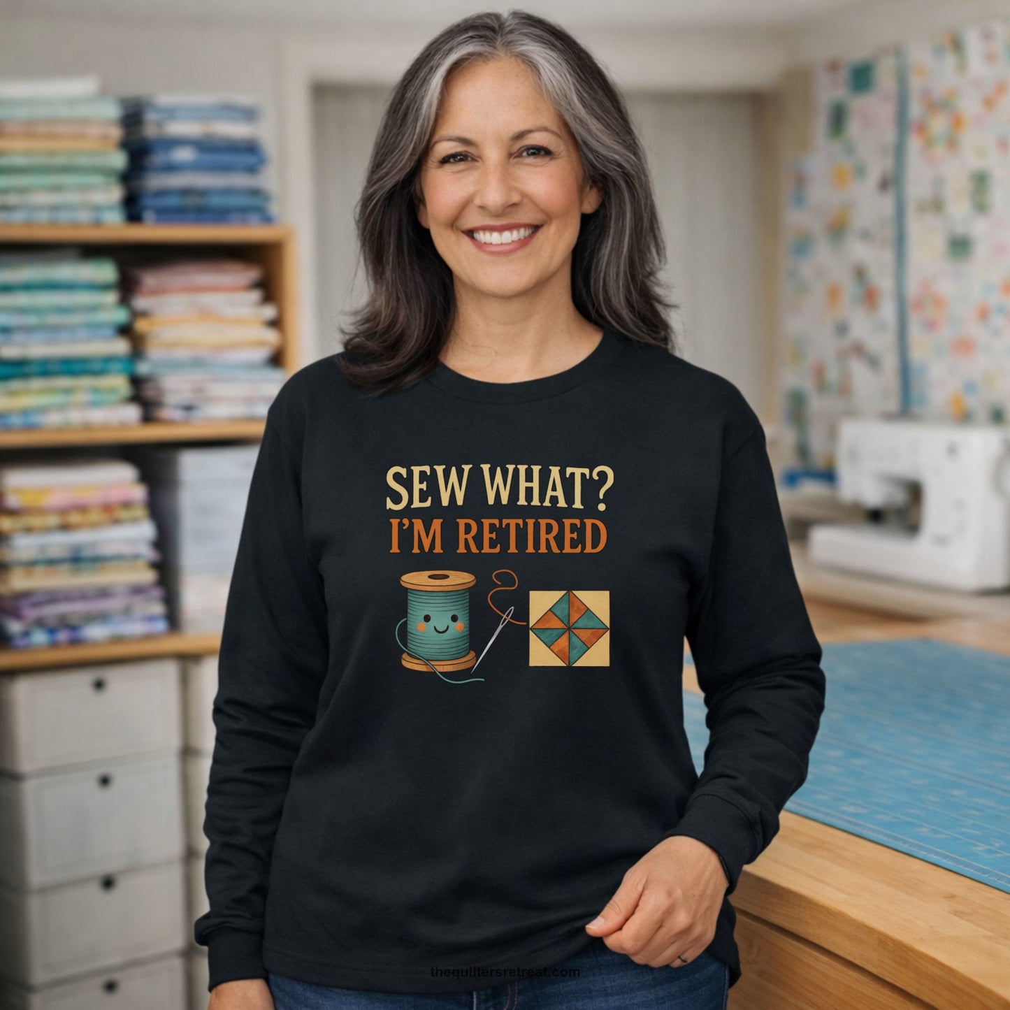 A Long Sleeve T-Shirt with a funny "Sew What? I'm Retired" text with smiling spool and quilt block design