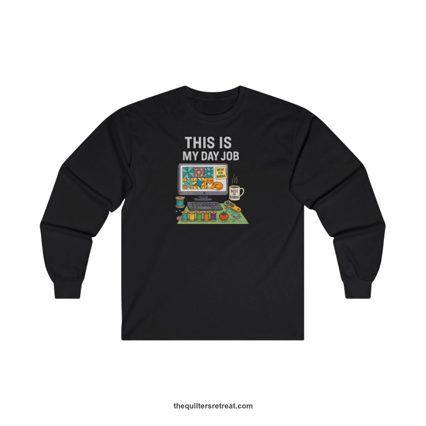 A Black Long Sleeve T-Shirt with a computer quilt design, cat illustration, "THIS IS MY DAY JOB" text with sewing tools, playful style