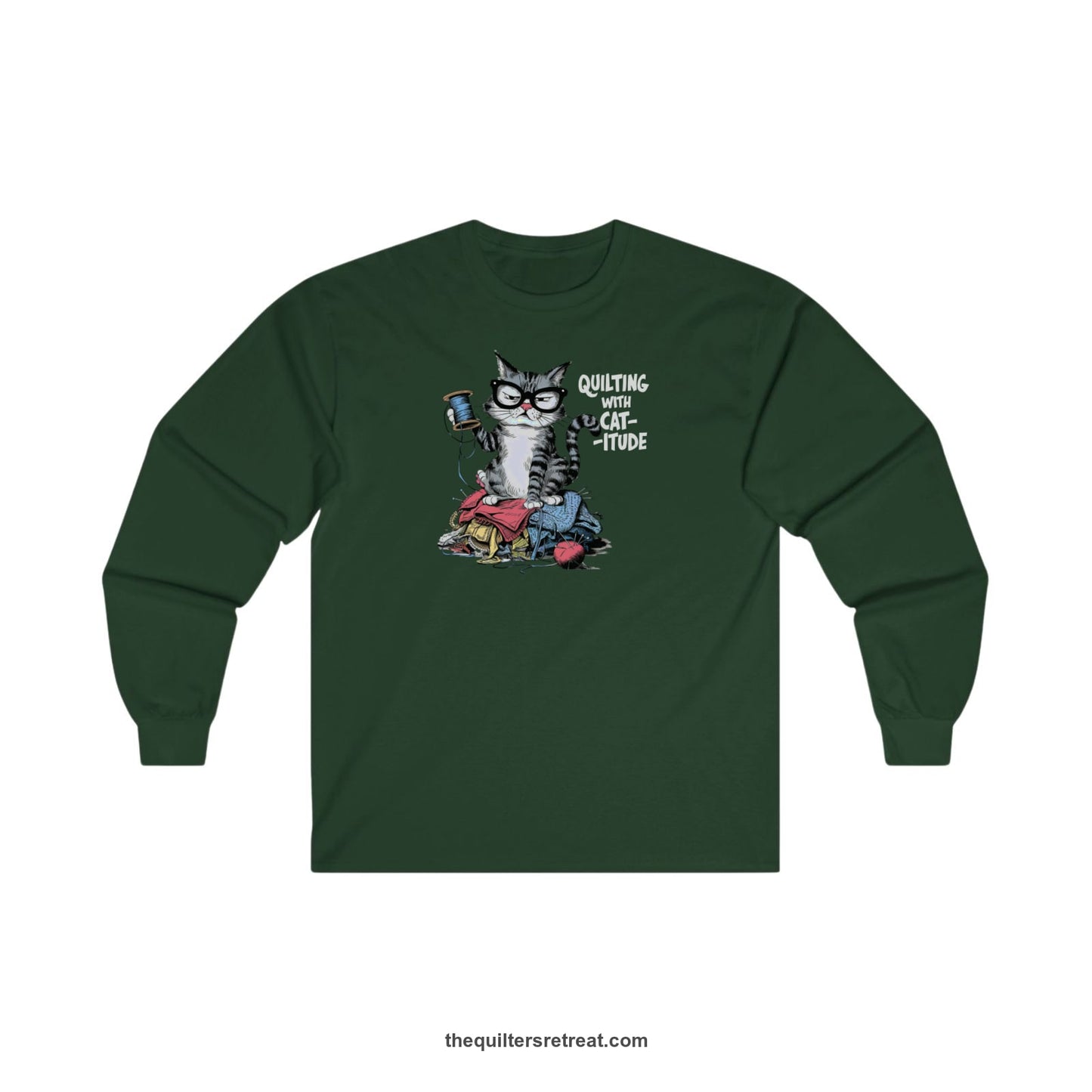A Forest Green Long Sleeve T-Shirt with a grumpy cat holding thread spool atop fabric pile with "Quilting with Cat-itude" text