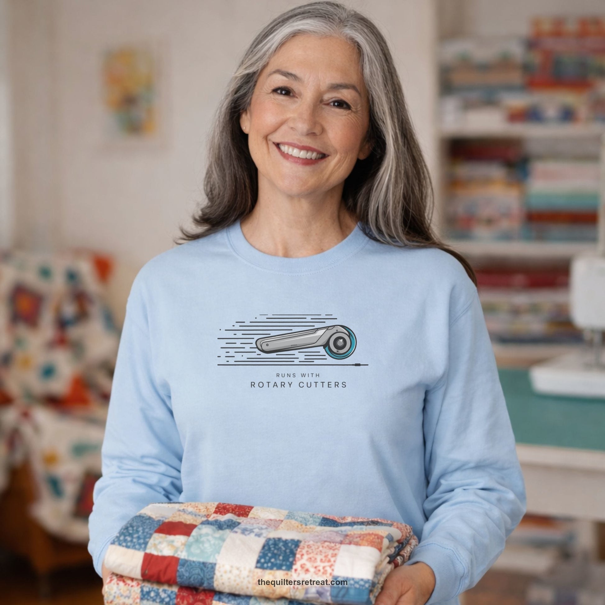 A Long Sleeve T-Shirt with a rotary cutter illustration with dynamic lines and bold "Runs with Rotary Cutters" text