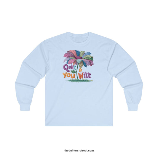 A Long Sleeve T-Shirt with a whimsical quilted flower with bold "Quilt til You Wilt" text