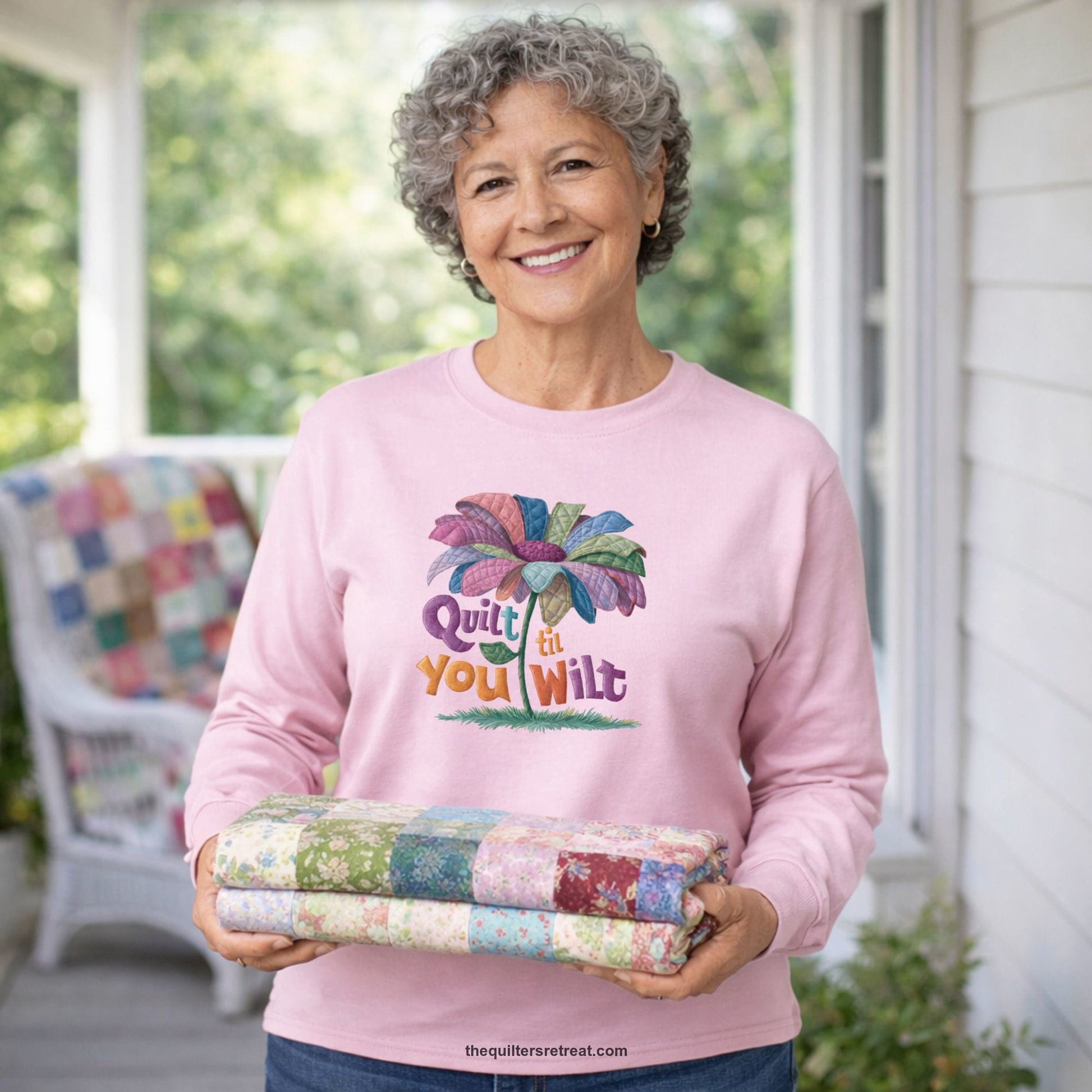 A Long Sleeve T-Shirt with a whimsical quilted flower with bold "Quilt til You Wilt" text